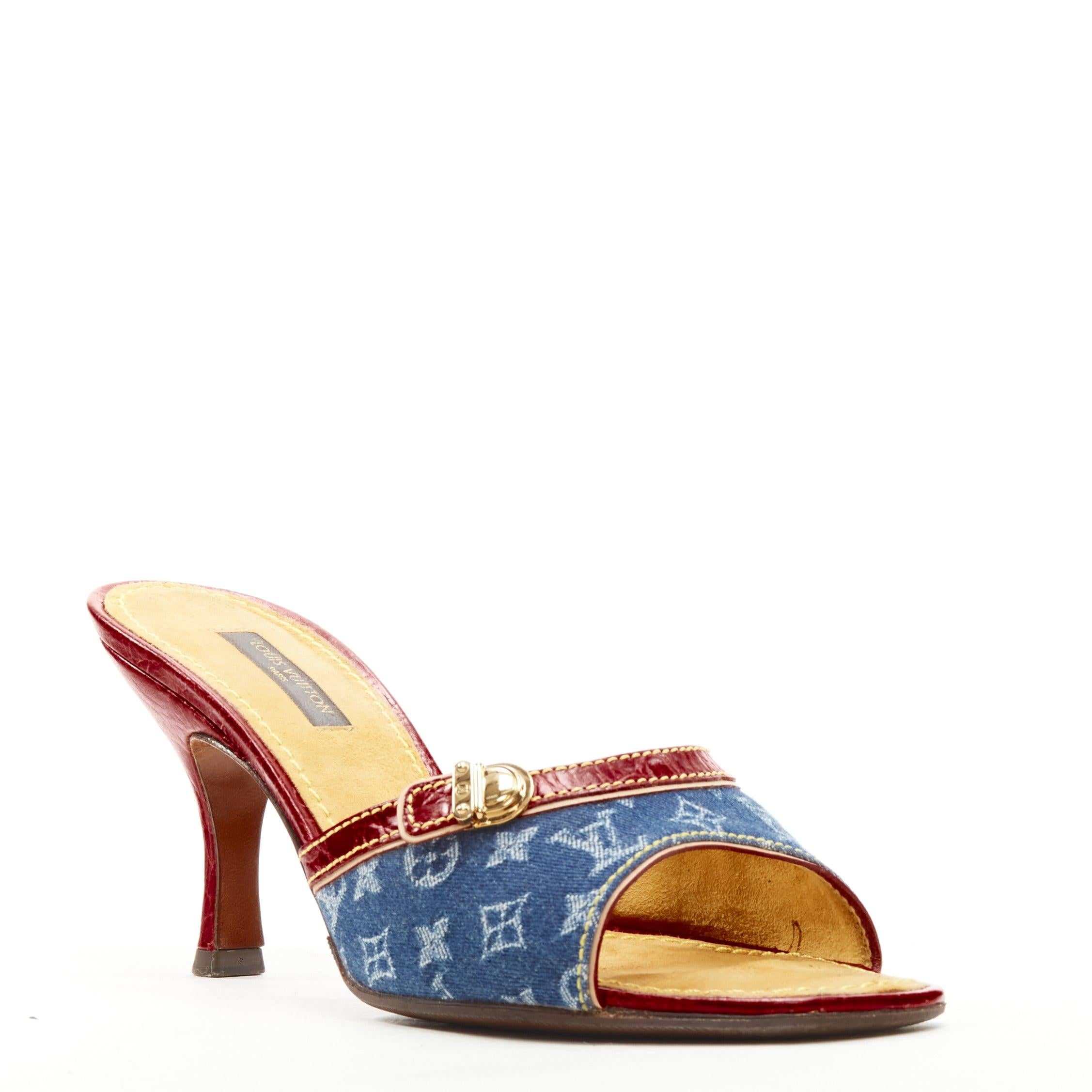 LOUIS VUITTON Y2K blue denim buckle leather high heel mule sandal EU37
Reference: ANWU/A00973
Brand: Louis Vuitton
Designer: Marc Jacobs
Material: Denim, Leather
Color: Blue, Red
Pattern: Solid
Lining: Suede
Extra Details: Gold-tone buckle detail.
