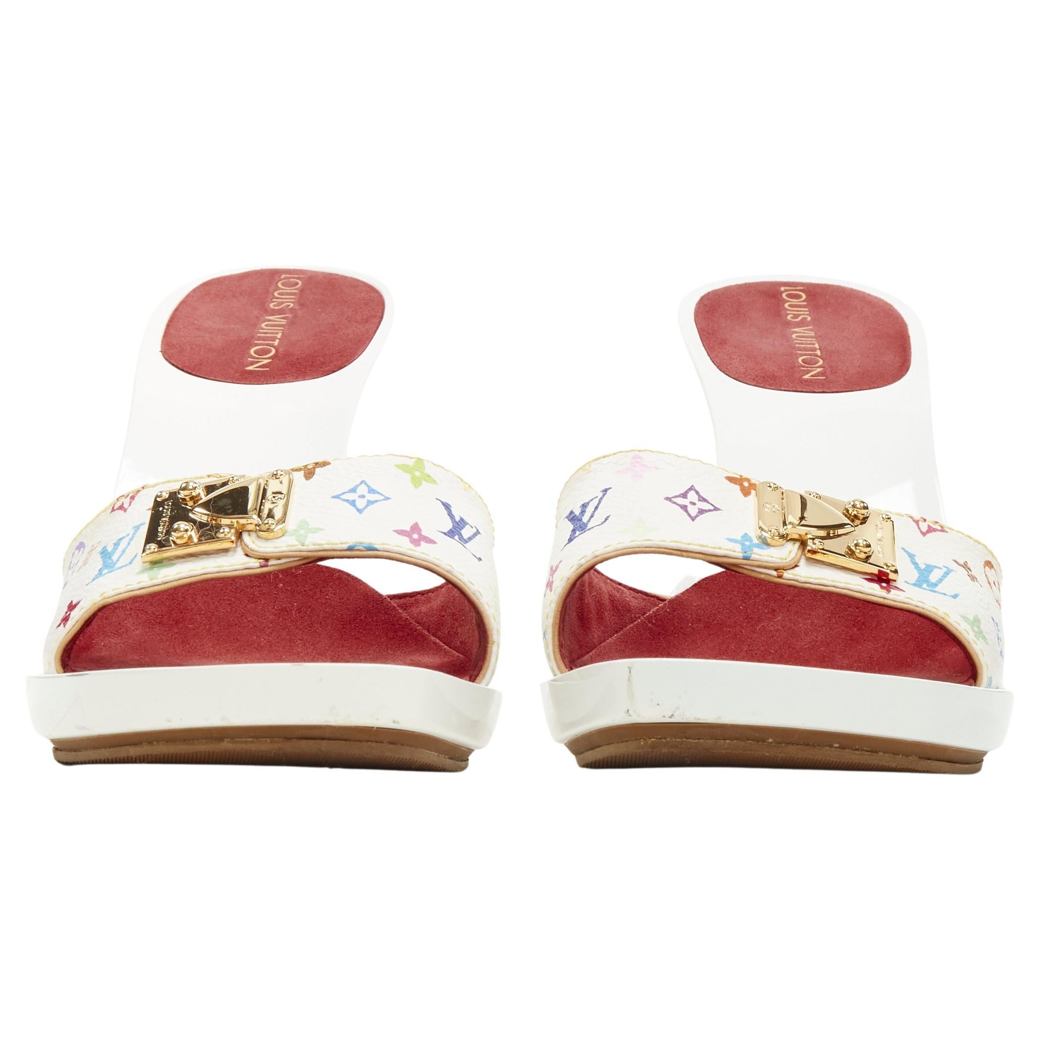 LOUIS VUITTON Y2K white multi monogram gold buckle high heel mule sandal EU37.5
Brand: Louis Vuitton
Material: Canvas
Color: White
Pattern: Logomania
Extra Detail: Gold-tone buckle.

CONDITION:
Condition: Very good, this item was pre-owned and is in