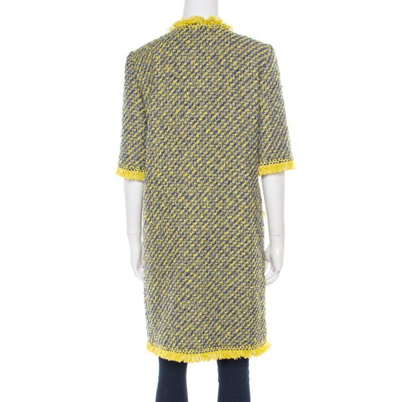 A sleek and stylish coat is a must have in every winter wardrobe for the fashionable woman in you, and this Louis Vuitton coat is sure to steal hearts with its quirky style and effortless charm. Constructed in yellow and blue tweed style with a