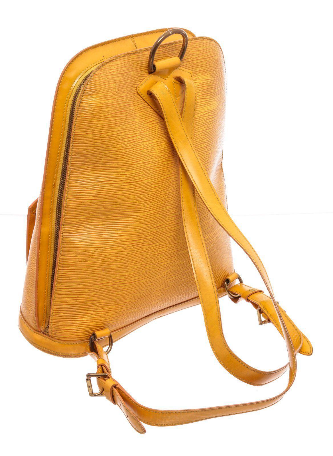 Louis Vuitton Yellow Epi Leather Gobelins Backpack with material epi leather, gold-tone hardware, trim tan vachetta leather, interior slip pockets, shoulder strap and zipper closure.