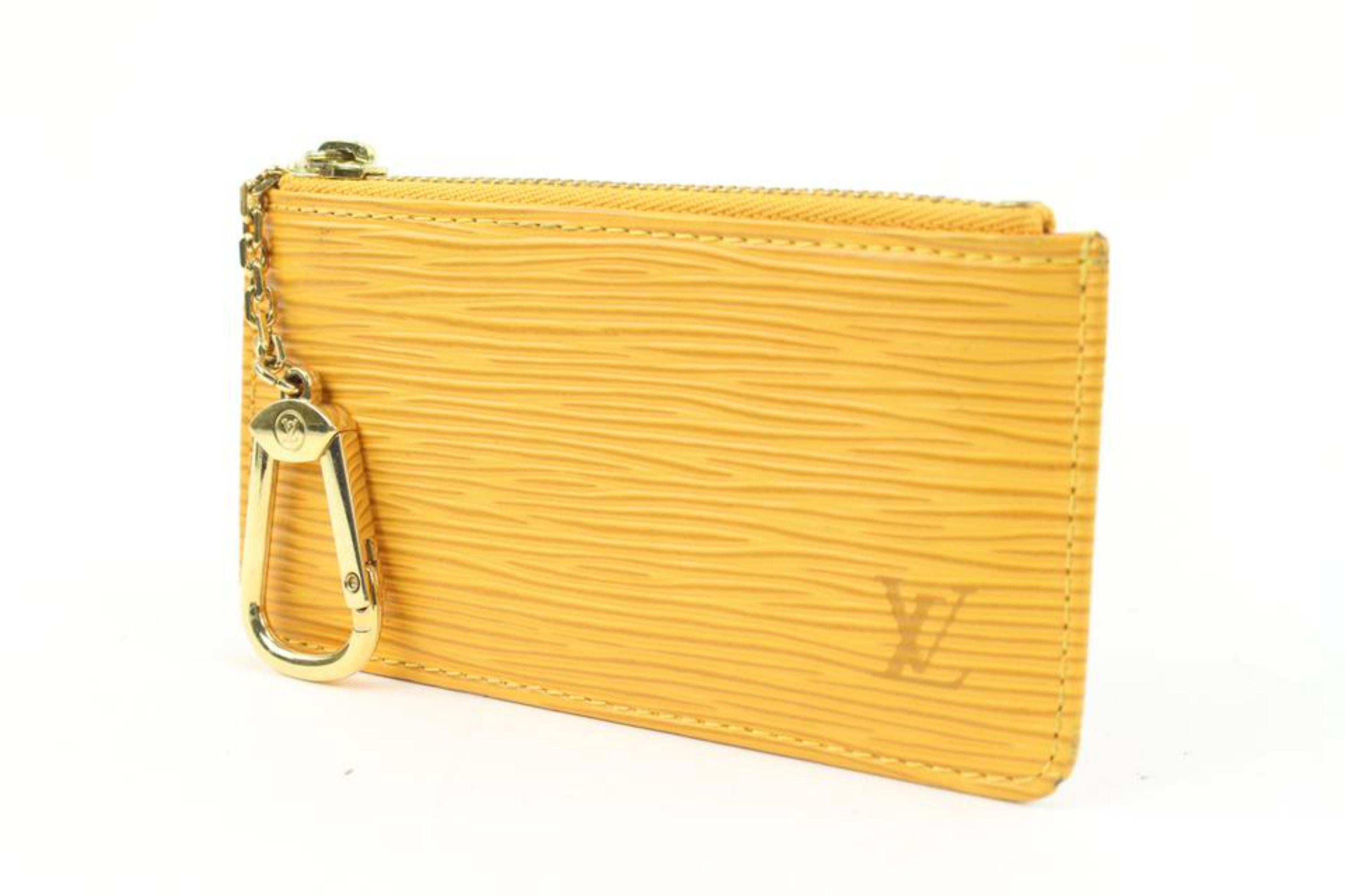 Louis Vuitton Yellow Epi Leather Key Pouch Keychain Pochette Cles s214lv79
Date Code/Serial Number: CA0024
Made In: Spain
Measurements: Length:  4.75