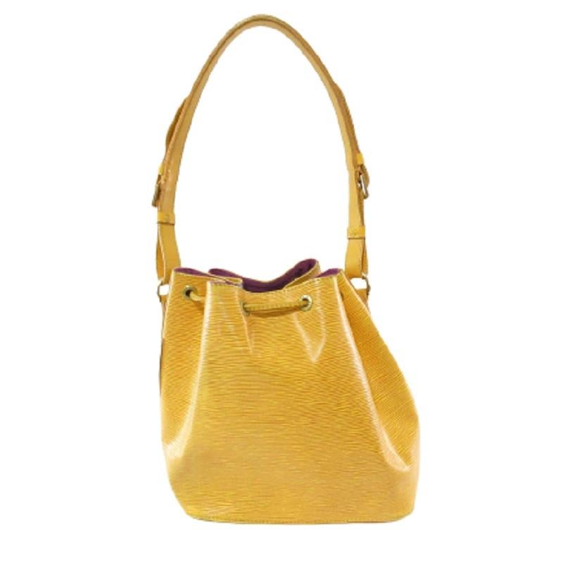 Yellow Epi leather Louis Vuitton Noe PM with gold-tone hardware, adjustable flat shoulder strap, fuchsia Alcantara lining and drawstring closure at top.


69752MSC

10