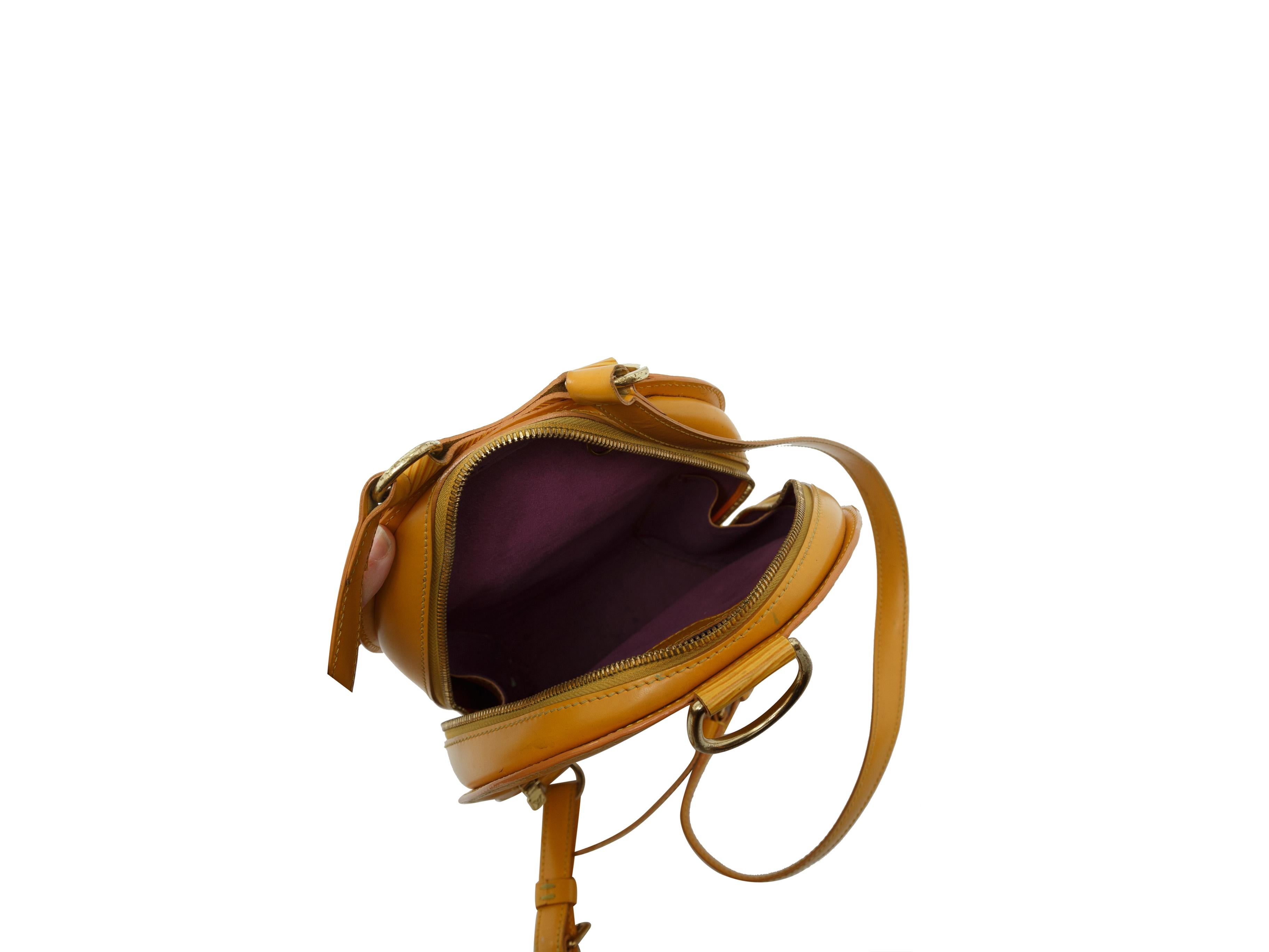 Product details: Yellow Epi Mabillon leather backpack by Louis Vuitton. Gold-tone hardware. Exterior back zip pocket. Adjustable shoulder straps. Zip closure at top. 8.5