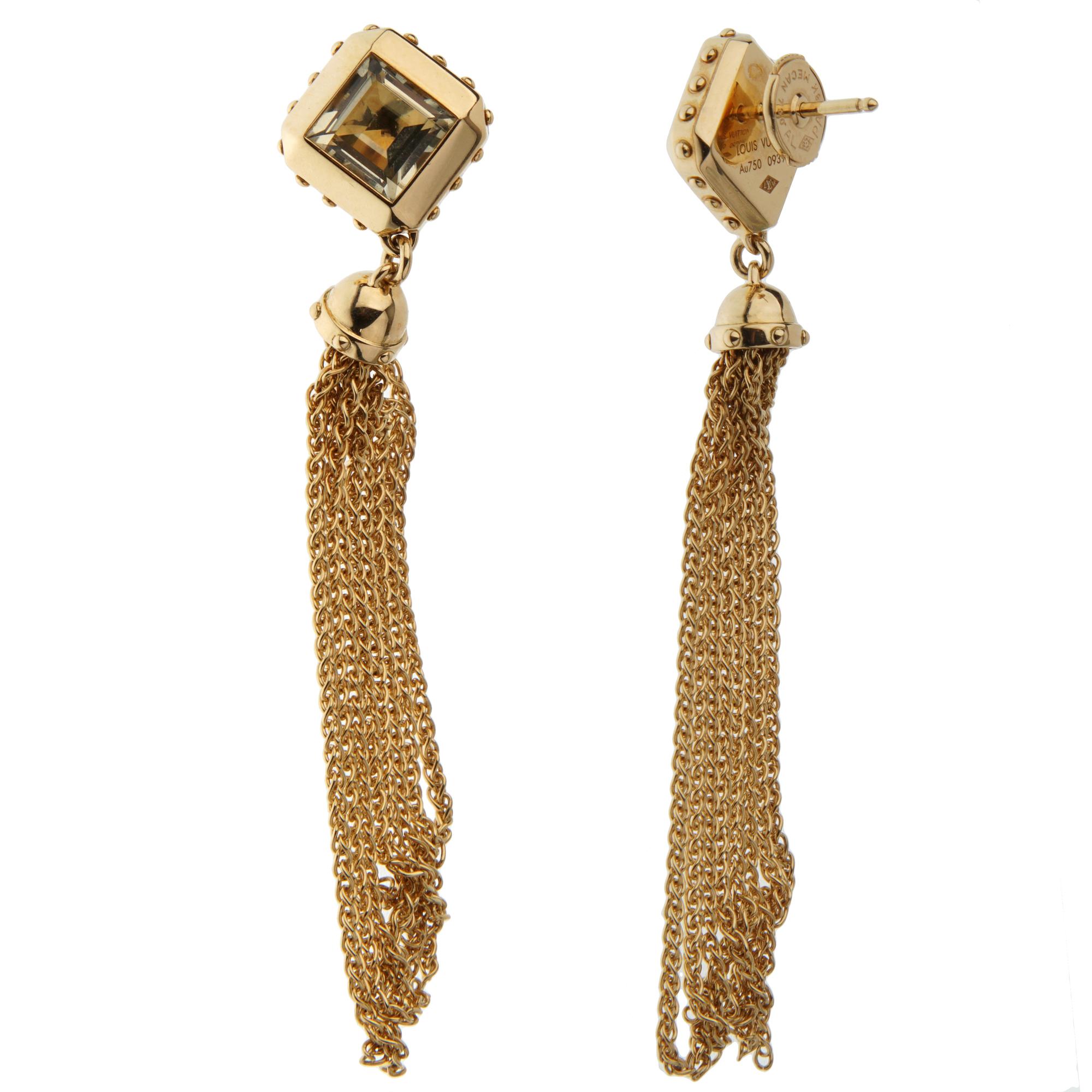 A fabulous pair of Louis Vuitton earrings showcasing 2 step cut quartz stones followed by a multi chain tassel in 18k yellow gold.