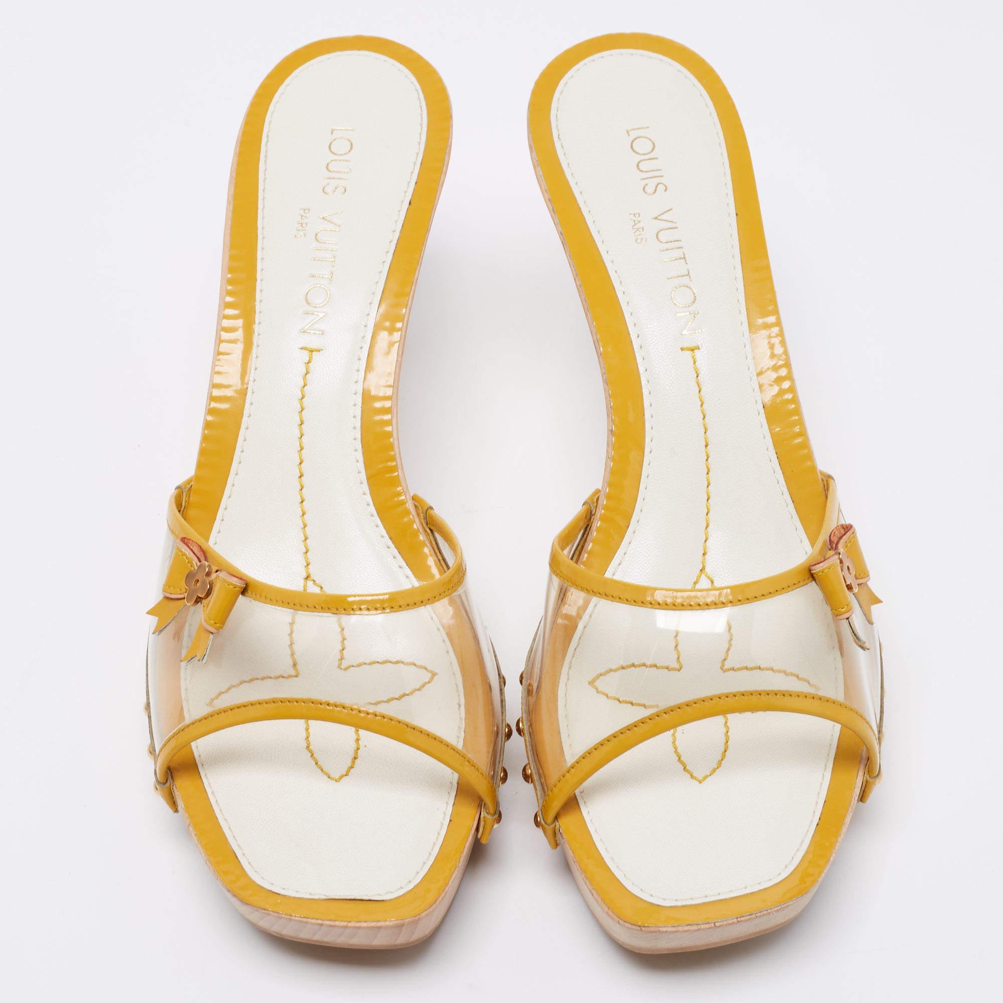 Pretty and minimal, these Louis Vuitton sandals tops in highlighting the feminine charm. Crafted from patent leather, they feature open toes, PVC vamps, and delicate bow details on their sides. Elevated on 10 cm heels, they come with leather-lined
