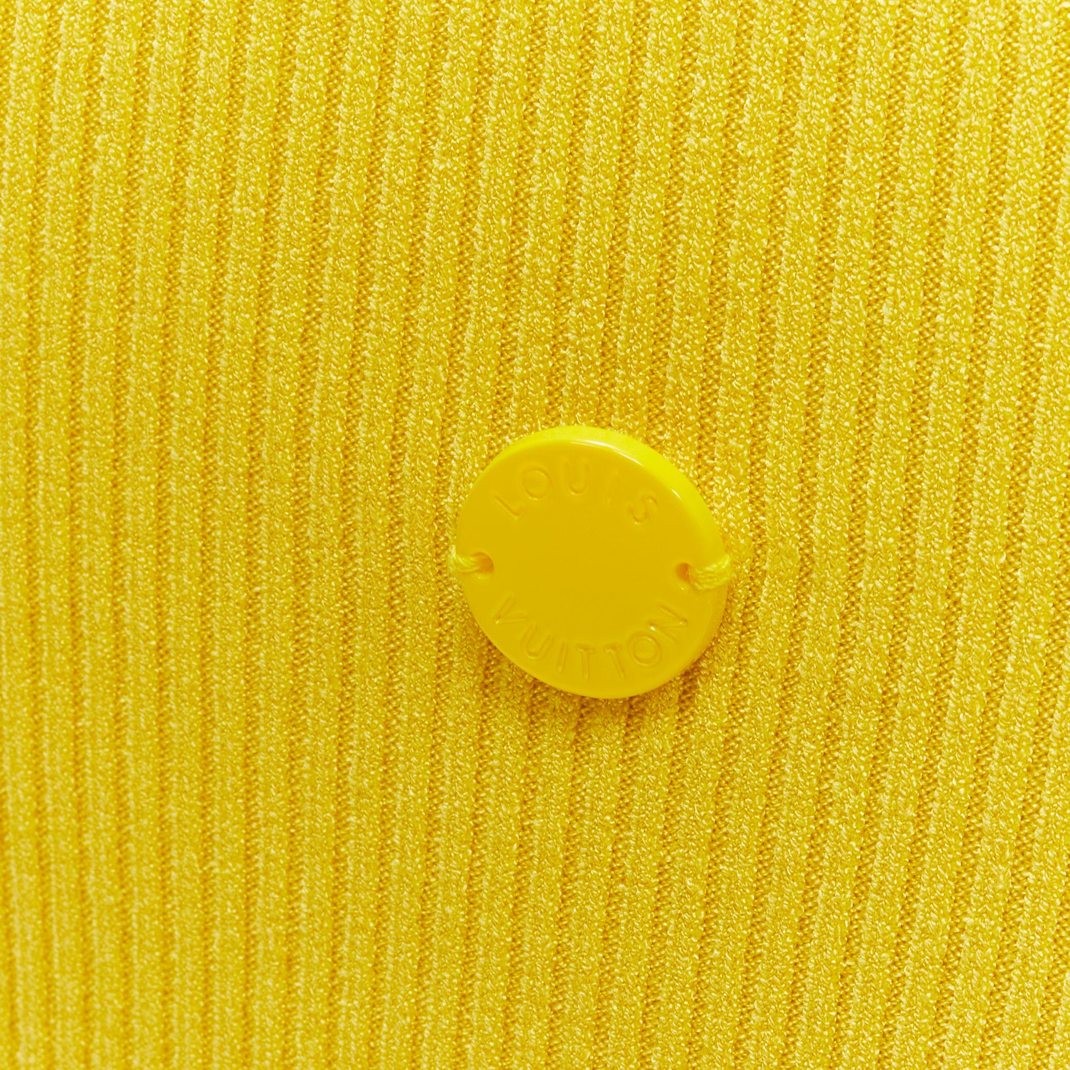 LOUIS VUITTON yellow ribbed knit tonal button charm long sleeve top XS
Brand: Louis Vuitton
Material: Feels like cotton
Color: Yellow
Pattern: Solid
Extra Detail: LV logo button charm at front hem.

CONDITION:
Condition: Excellent, this item was