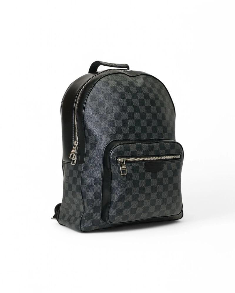Louis Vuitton signature backpack, model Josh in size GM, made of Damier Graphite canvas with black leather trim and silver hardware. Featuring a double-slider zipper top closure, internally lined in black canvas with convenient pockets, the backpack