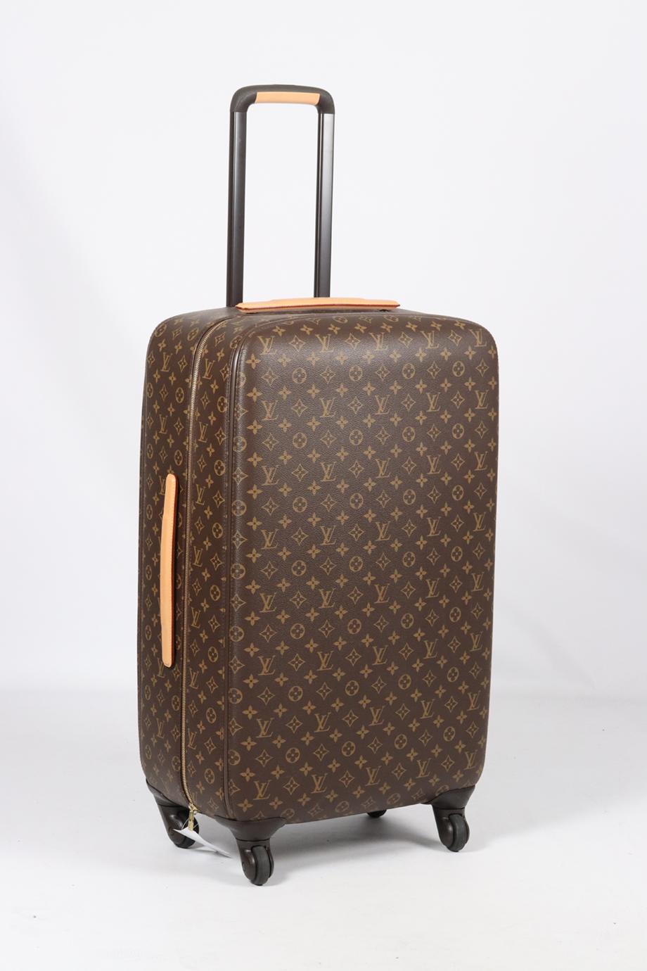 <ul>
<li>Louis Vuitton Zephyr 70 Monogram Coated Canvas And Leather Suitcase.</li>
<li>Brown.</li>
<li>Zip fastening - Top.</li>
<li>Comes with - dustbag and box.</li>
<li><strong>Height: 26.2 in.</strong></li>
<li><strong>Width: 17.1