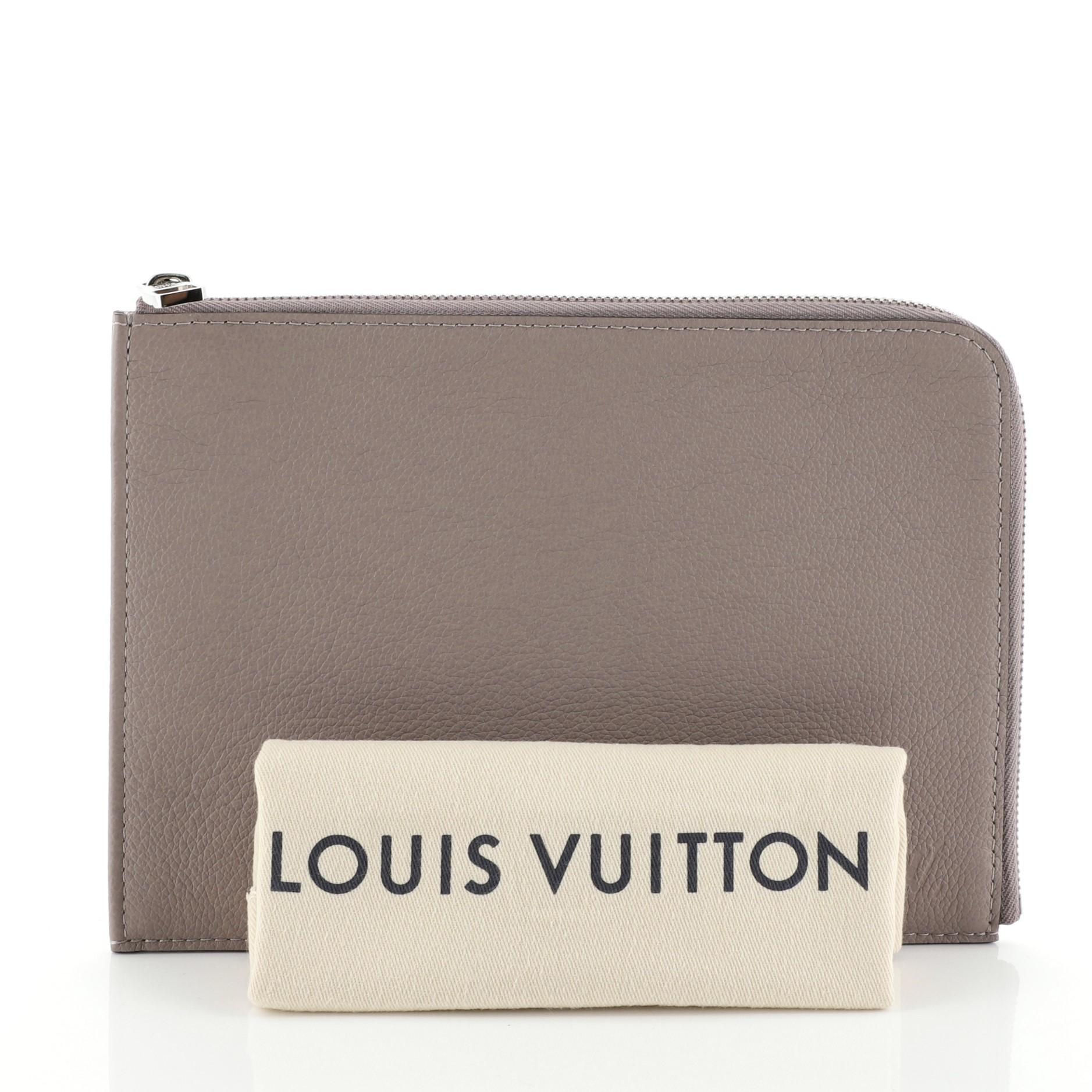 This Louis Vuitton Zip Around Pochette Jour Leather PM, crafted in purple leather, features silver-tone hardware. Its zip closure opens to a neutral microfiber interior with slip pocket. Authenticity code reads: TH4177. 

Estimated Retail Price: