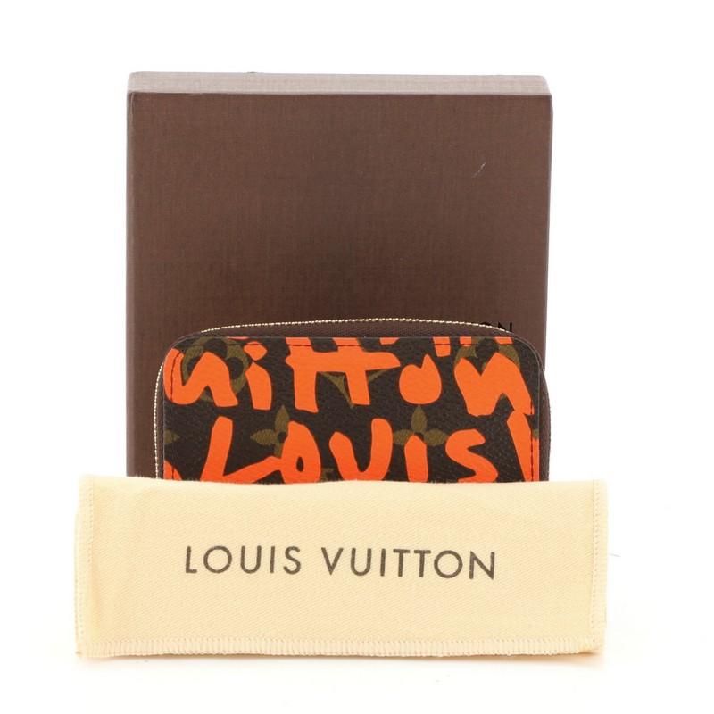 This Louis Vuitton Zippy Coin Purse Limited Edition Monogram Graffiti, crafted in brown monogram coated canvas with orange graffiti print, features gold-tone hardware. Its zip closure opens to an orange leather interior with multiple card slots and