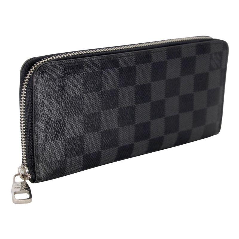 Louis Vuitton Zippy GM Damier Long Graphite Wallet LV-1111P-0010

This is a extremely rare and unique wallet crafted of traditional Louis Vuitton graphite damier monogram with check toile canvas monogram logos. This wallet style has been sold out