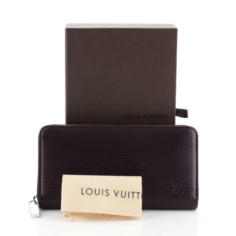 This Louis Vuitton Zippy Wallet Epi Leather, crafted in purple epi leather, features silver-tone hardware. Its zip around closure opens to a purple leather interior with multiple card slots, zip compartment and slip pocket. Authenticity code reads: