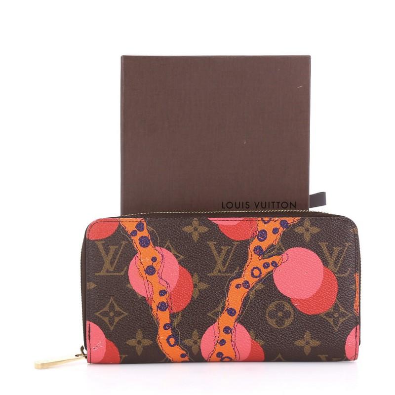 This Louis Vuitton Zippy Wallet Limited Edition Monogram Canvas, crafted from brown monogram coated canvas, features printed overlay and gold-tone hardware. Its zip around closure opens to a pink leather interior with middle zip compartment, slip