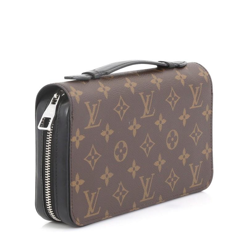 This Louis Vuitton Zippy Wallet Macassar Monogram Canvas XL, crafted from brown monogram coated canvas, features silver-tone hardware. Its zip around closure opens to a black leather interior with middle zip compartment, multiple card slots, and