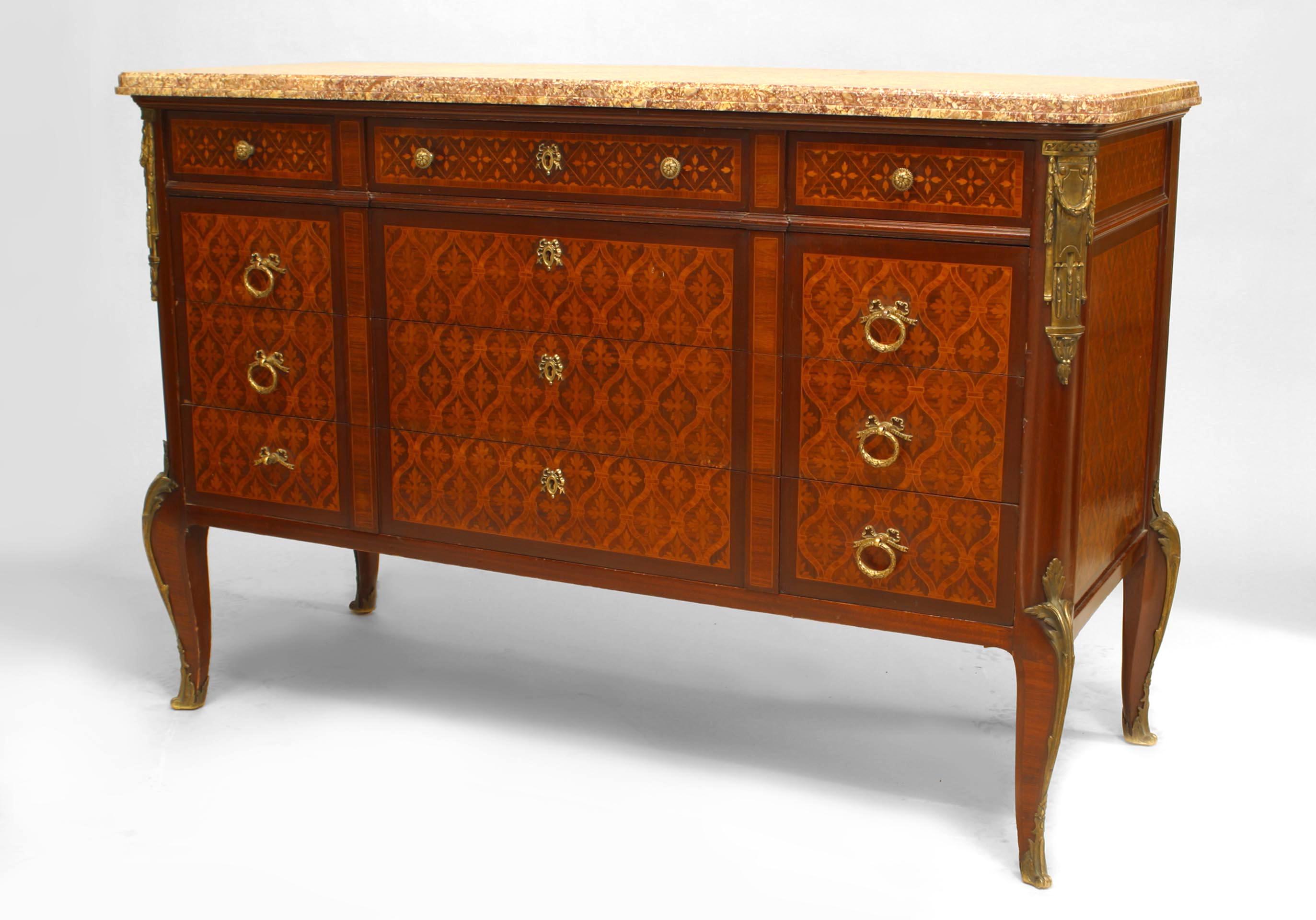 French Louis XVI 6 drawer commode with bronze trim and marquetry inlaid veneer with a marble top.
