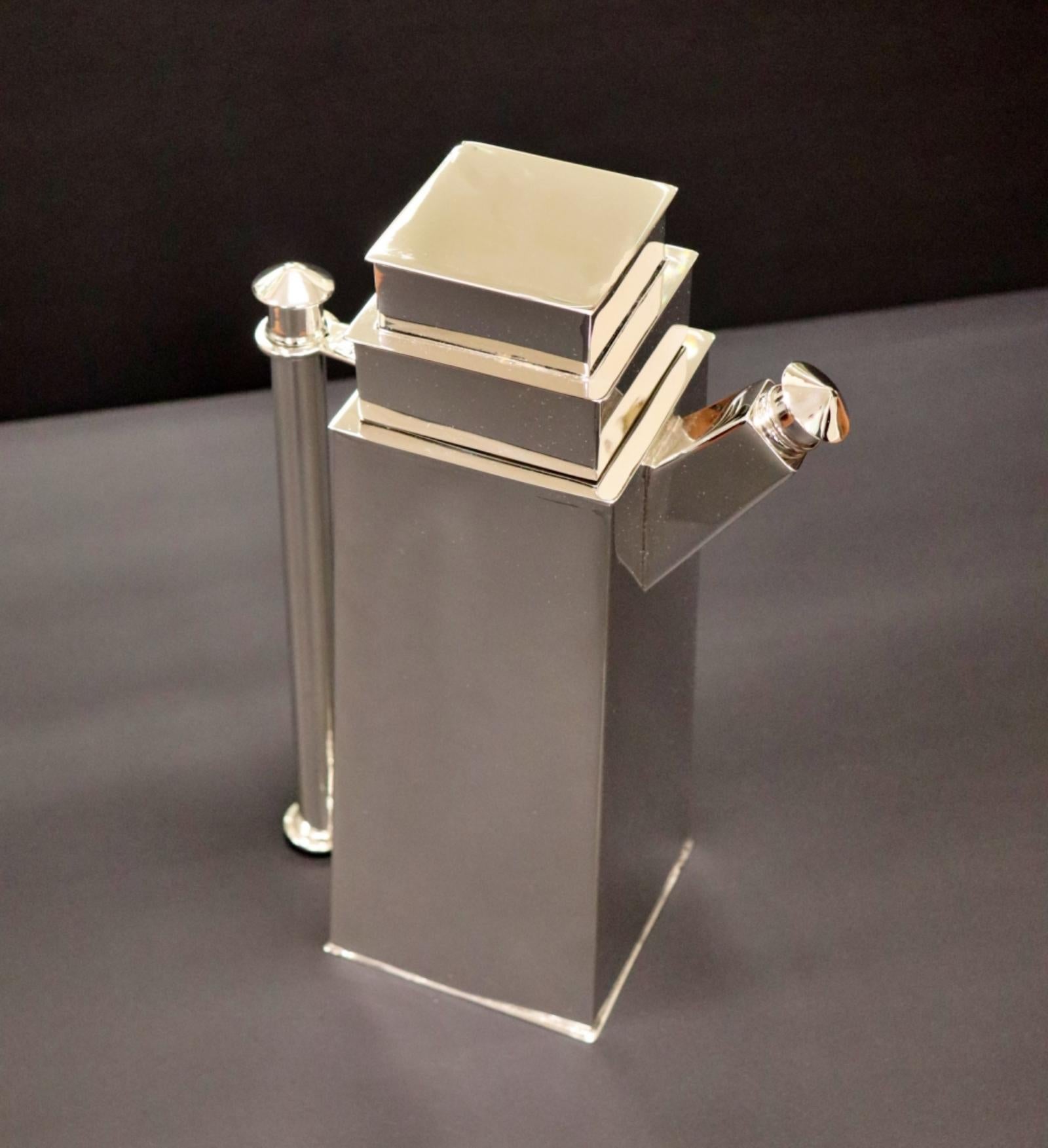 Louis W. Rice (1872 - 1933). Bernard Rice's son. Rare Skyscraper cocktail shaker, New York, 1920 - 22. Electroplated nickel silver. Stamped Skyscraper/DES.PAT.PENDING/APOLLO E.P.N.S./Made by Bernard Rice's Sons, Inc./5257. The stepped, architectural