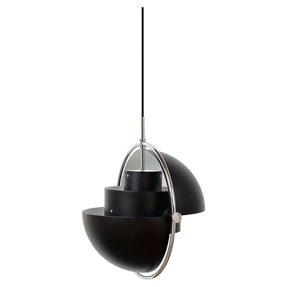 The small Multi-Lite Pendant embraces the golden era of Danish design with its characteristic shape of two opposing outside, mobile shades that enable creating a personal installation and a wide range of lighting values in a room. By individually