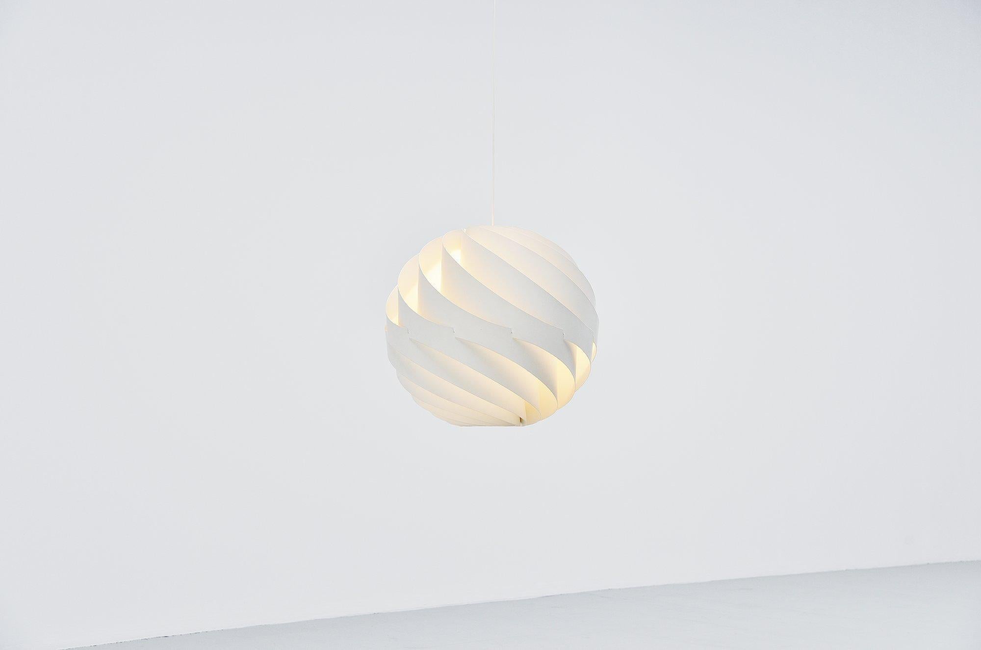 Fantastic large pendant lamp called Turbo designed by Louis Weisdorf and manufactured by Lyfa, Denmark 1965. This super shaped large pendant lamp is made of aluminium layers rotated into a turbo. Gives very nice warm light when lit, super spherical