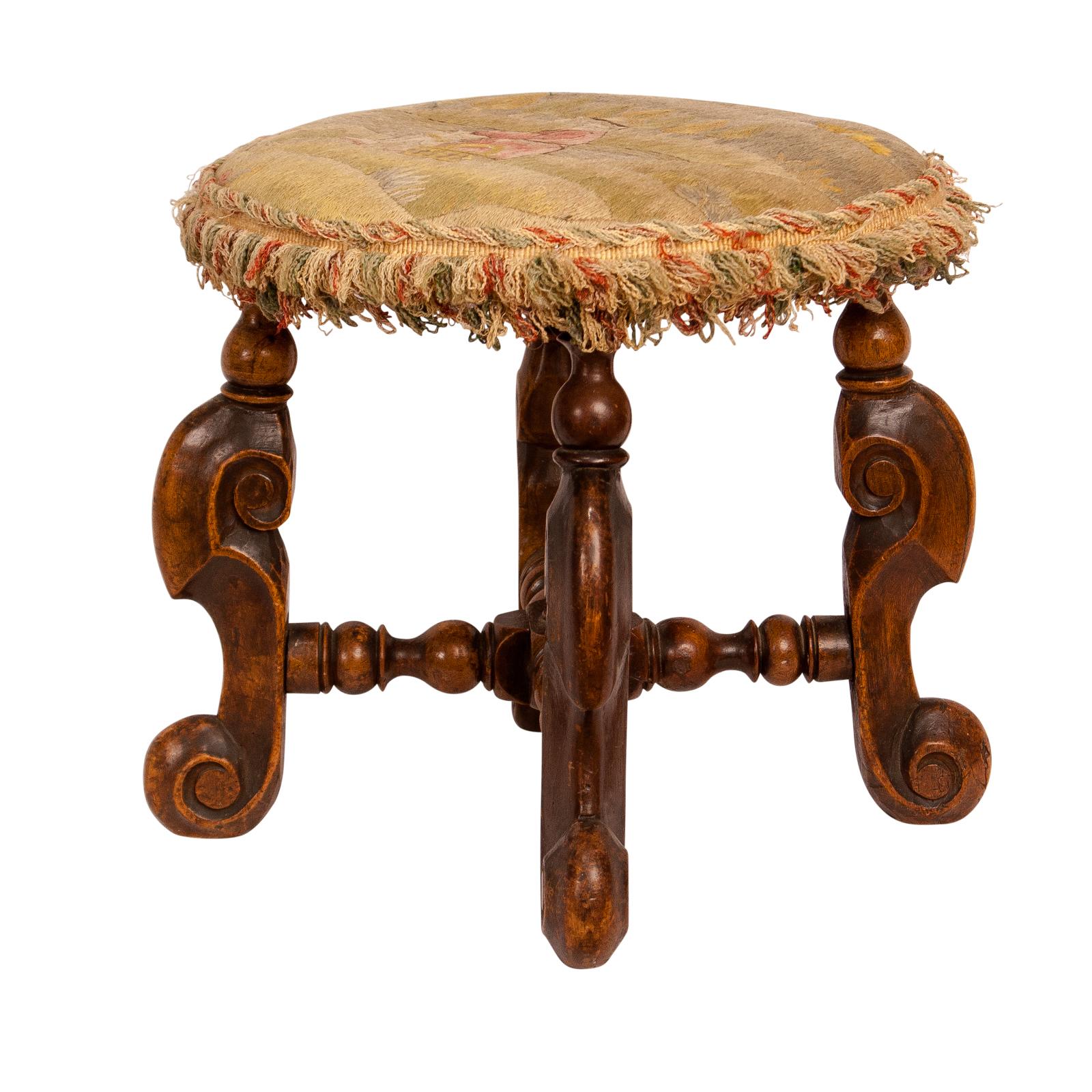 An early 17th century French walnut Louis XIII period foot stool, circa 1620. Great color and patina. Upholstered in crewel needlework probably associated.
 
 