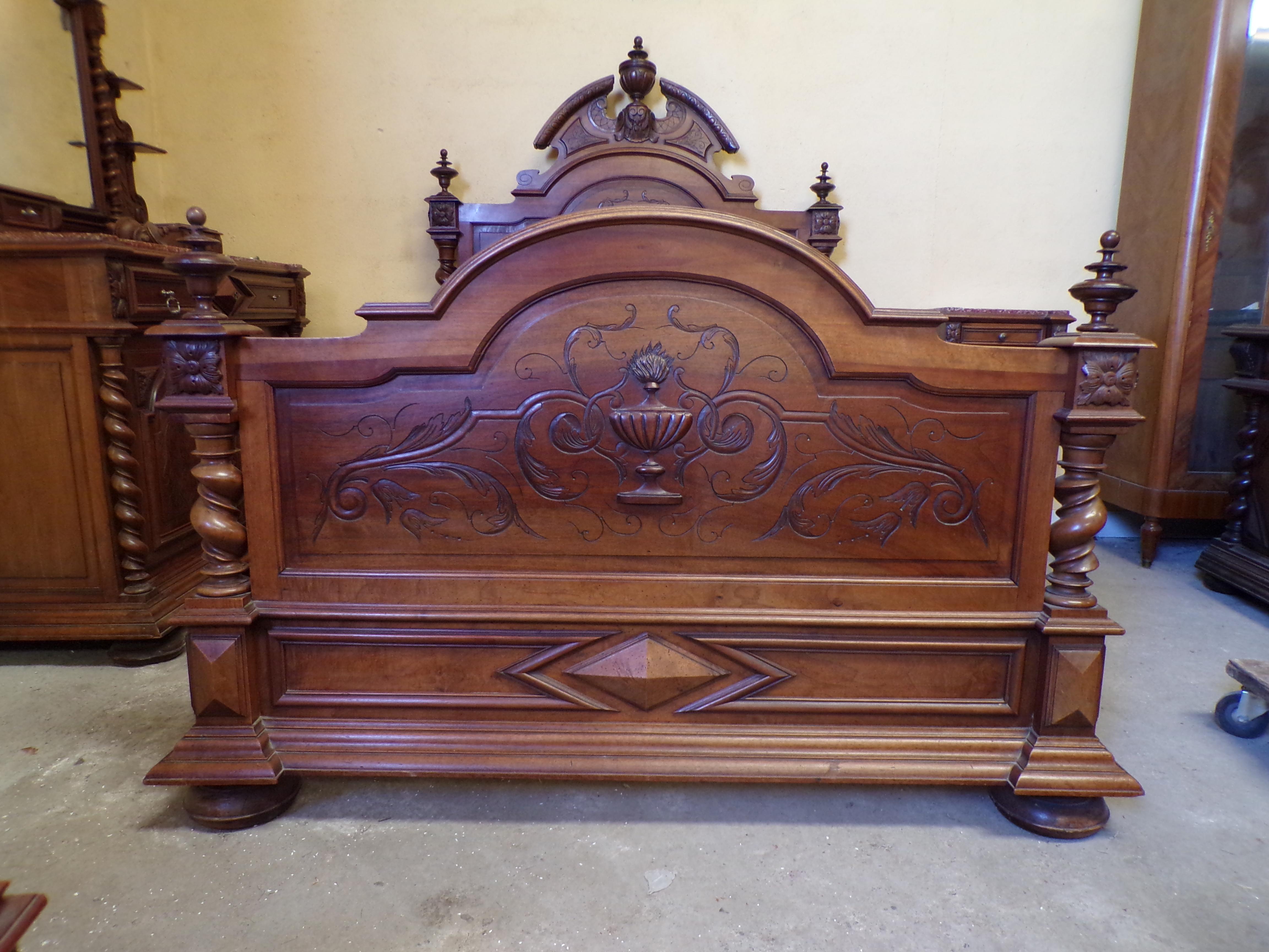 A fine quality hand carved increasingly rare all original Chateau bedroom suite in the Louis XIII style, circa 1890. Consisting of a grand bed , bedside cabinet, an imposing armoire and an impressive standing dressing chest. All in solid Walnut and