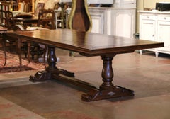 Louis XIII French Carved Walnut Trestle Farm Table with Fleurs-de-Lys Motifs