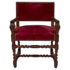 Fauteuil de style Louis XIII/ Haute Époque avec des femmes sculptées sur les accoudoirs.