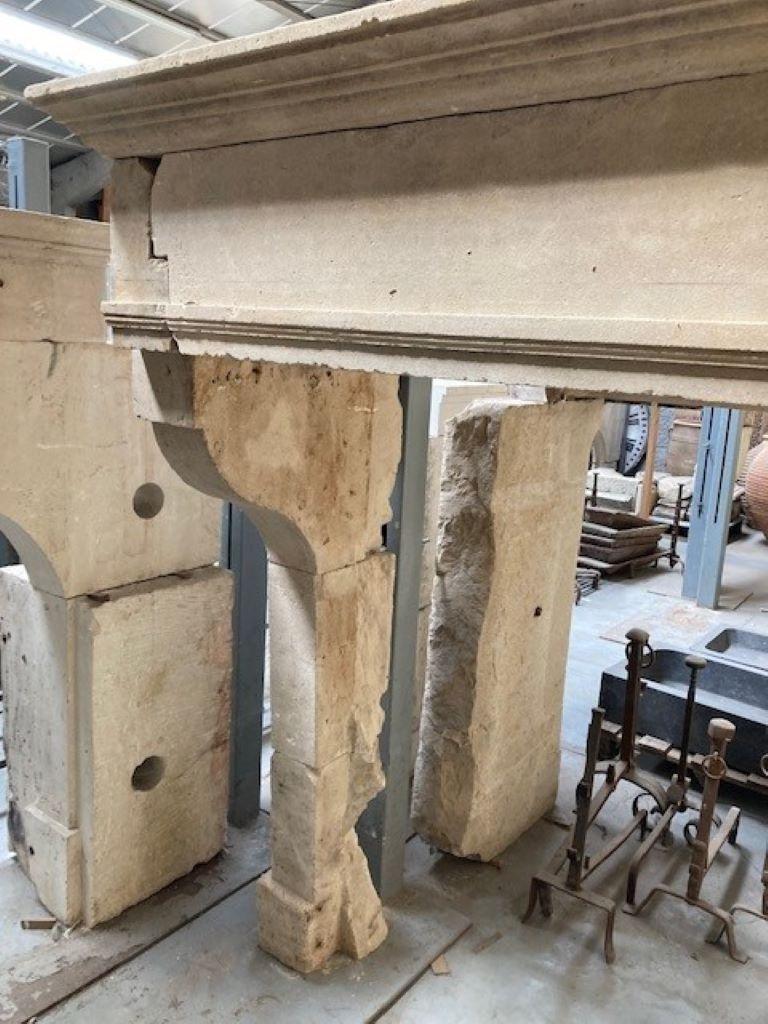 Carved Louis XIII Limestone Fireplace For Sale