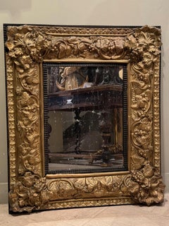 Louis XIII mirror in embossed copper, 19th C.