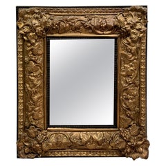 Louis XIII mirror in embossed copper, 19th C.
