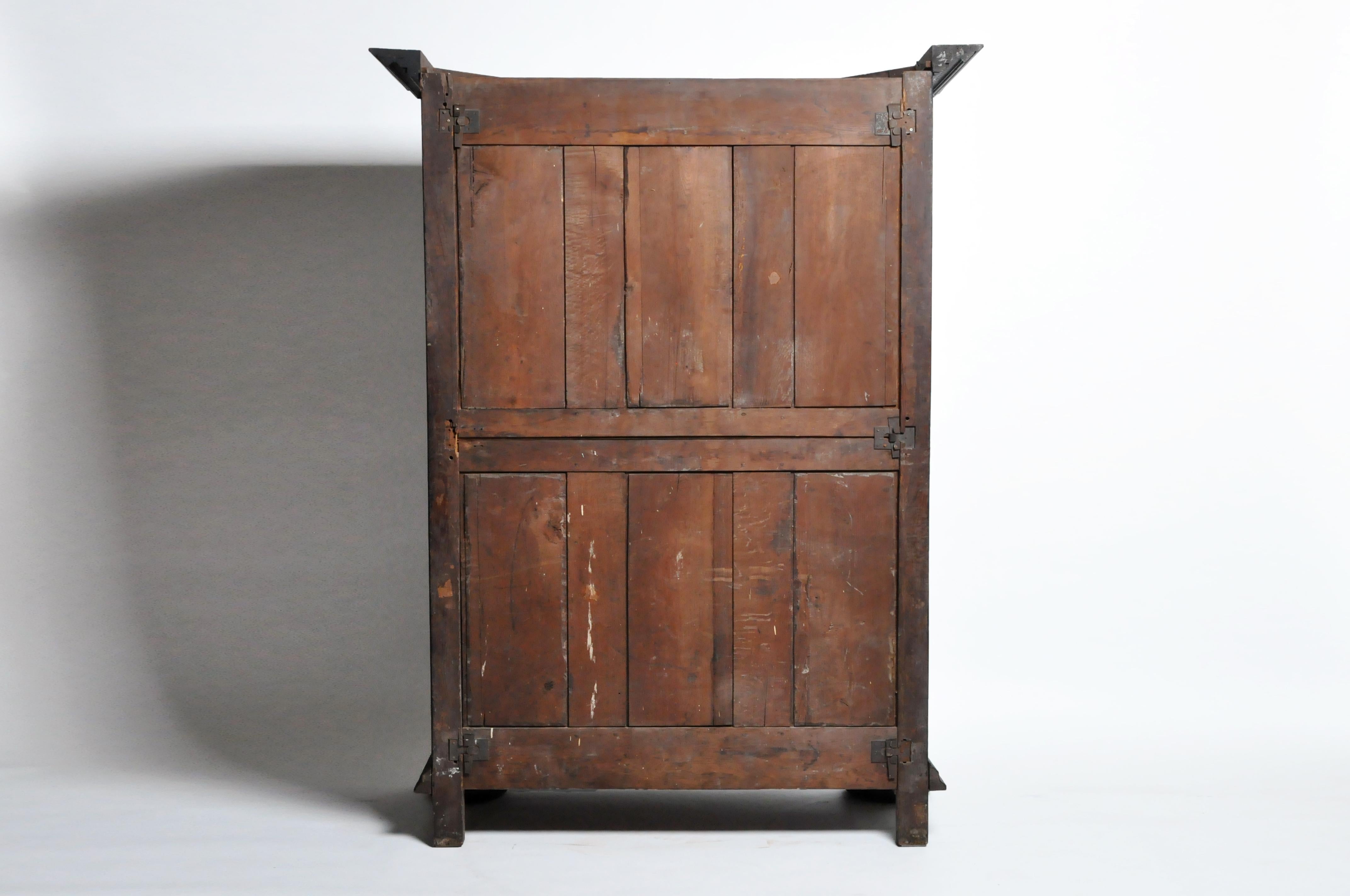 This handsome Louis XIII style armoire is from Lyons, France and was made from walnut wood, circa 18th century. The armoire's geometric style actually dates to a much earlier period but we think the piece is 18th century or early 19th. The piece