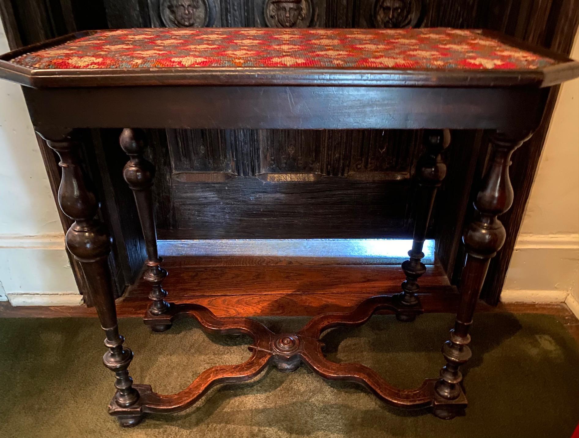 Lovely Louis XIV period occasional table with later needle-work top and raised on ring-turned baluster legs joined by an X-form stretcher.

Measures: 25