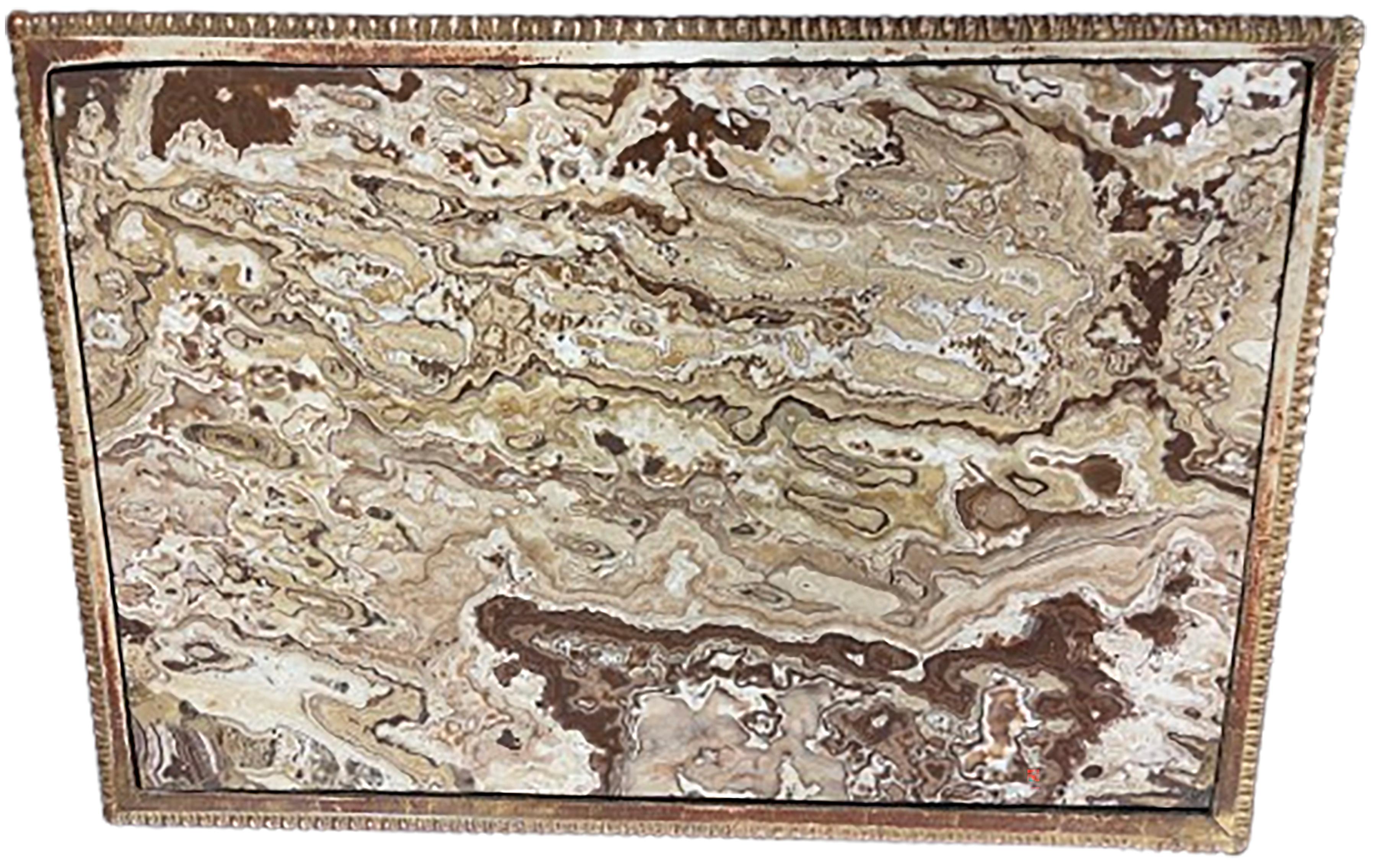 An exquisite carved Louis XIV giltwood period Console table, rectangular center and original marble tabletop. The marble is a mix of clay red, ochre yellow, and white. The colors and texture of the piece resemble the textures in the storm patterns