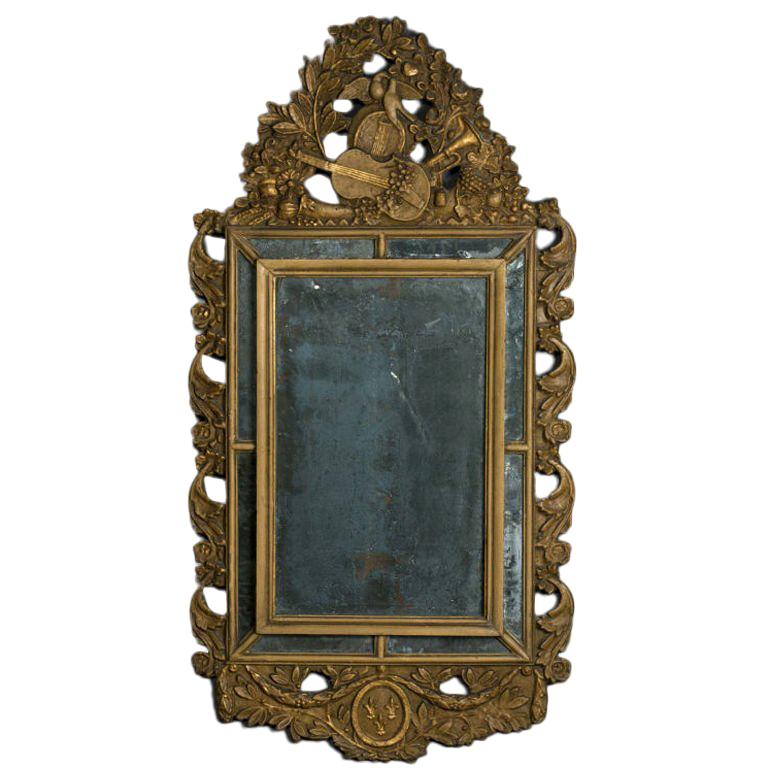 Miroir en bois doré de style Louis XIV