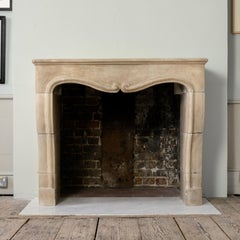 Louis XIV Limestone Fireplace