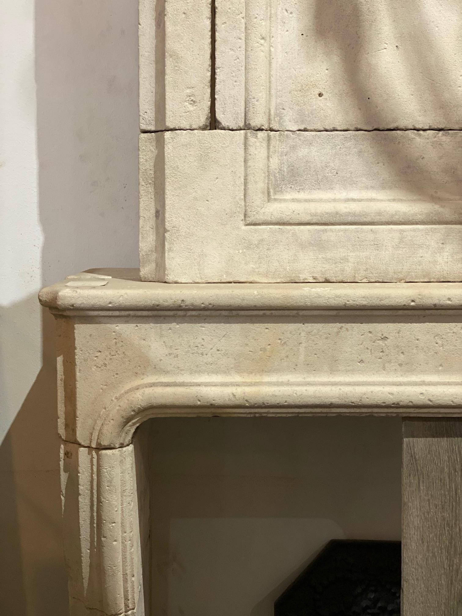 Louis XIV limestone mantel from France, circa 1880
Measurements: 118