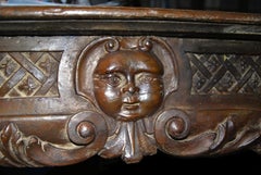 Louis XIV period carved wood fireplace mantel with humanized moon decoration