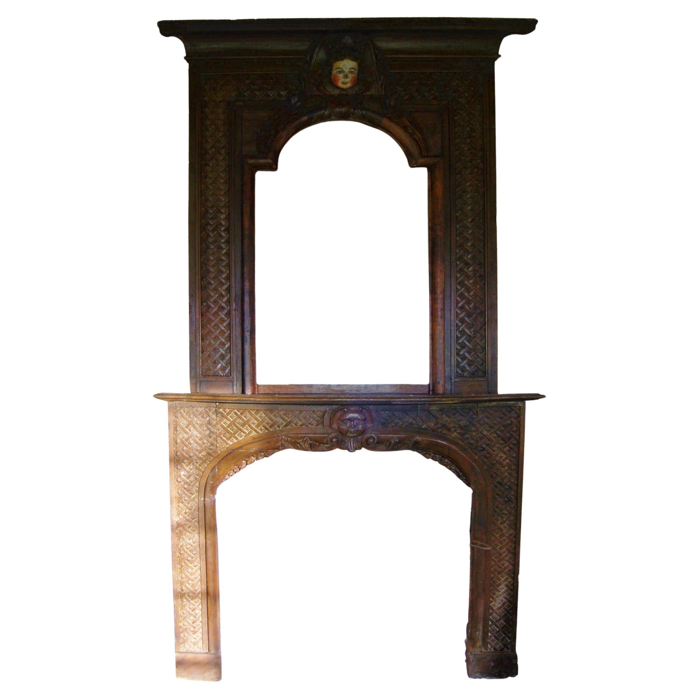 Louis XIV period carved wood fireplace mantel with humanized moon decoration For Sale