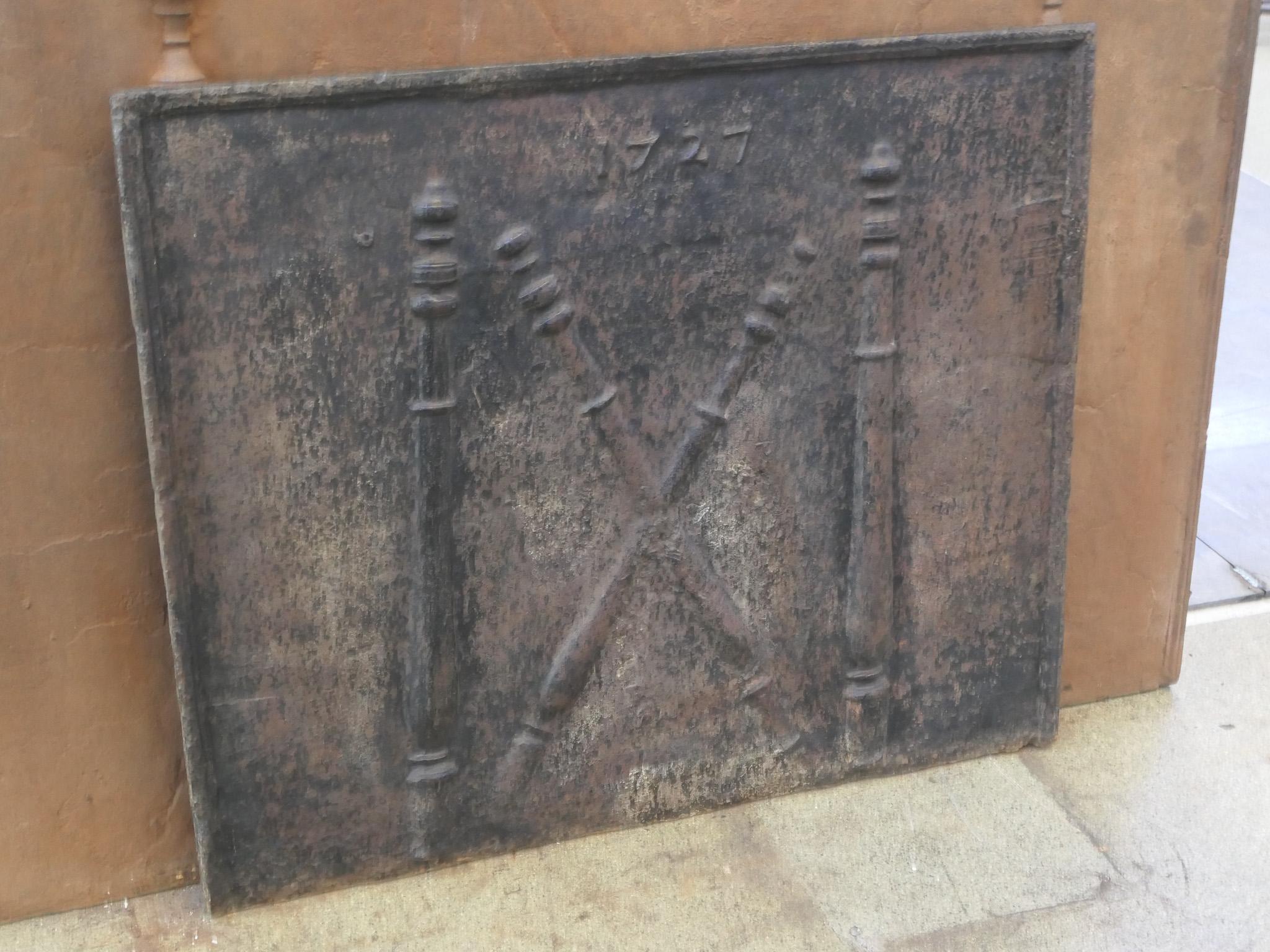 18th century French fireback with a Saint Andrew's cross and two pillars of Hercules. Saint Andrew is said to have been martyred on a cross in this shape. The cross is since then a sign for humility and sacrifice. The pillars of Hercules symbolize