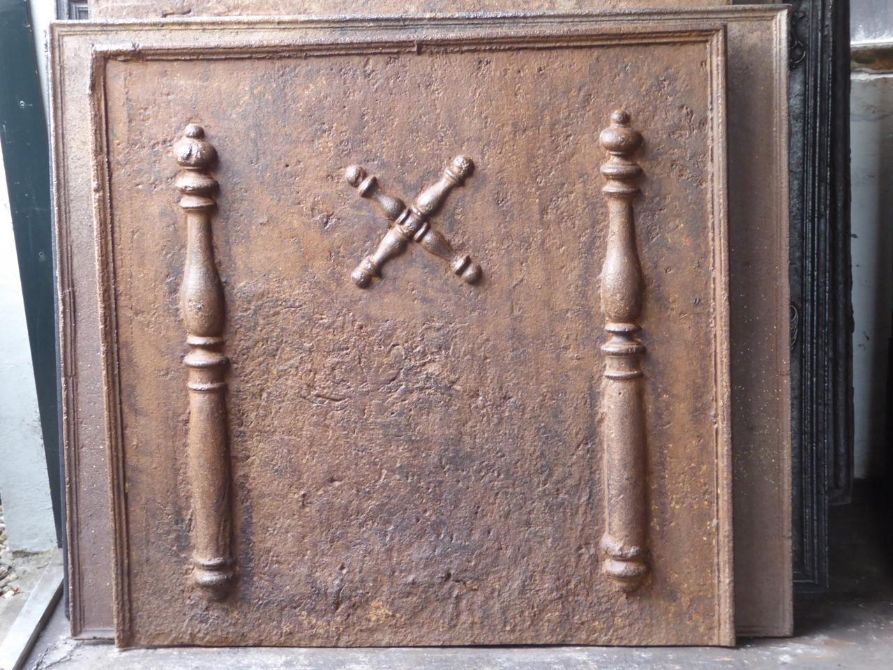 18th century French Louis XIV fireback with two pillars of Hercules and a Saint Andrew's cross. The pillar refers to the club of Hercules, his favourite weapon. It symbolizes power. Since antiquity the ‘Pillars of Hercules’ are also the name of the