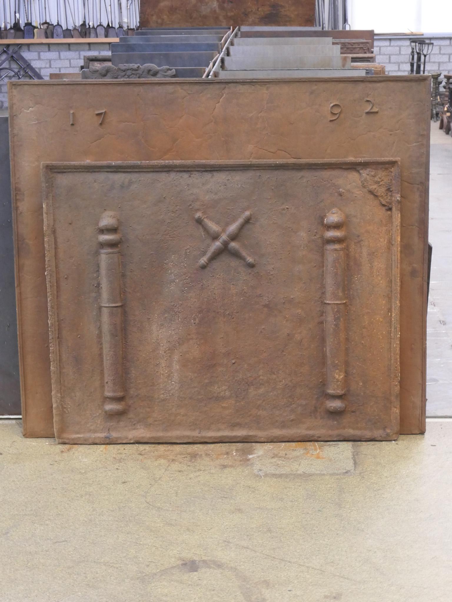 17th - 18th century French fireback with a Saint Andrew's cross and two pillars of Hercules. Saint Andrew is said to have been martyred on a cross in this shape. As a result, the cross became a sign for humility and sacrifice. The pillars of