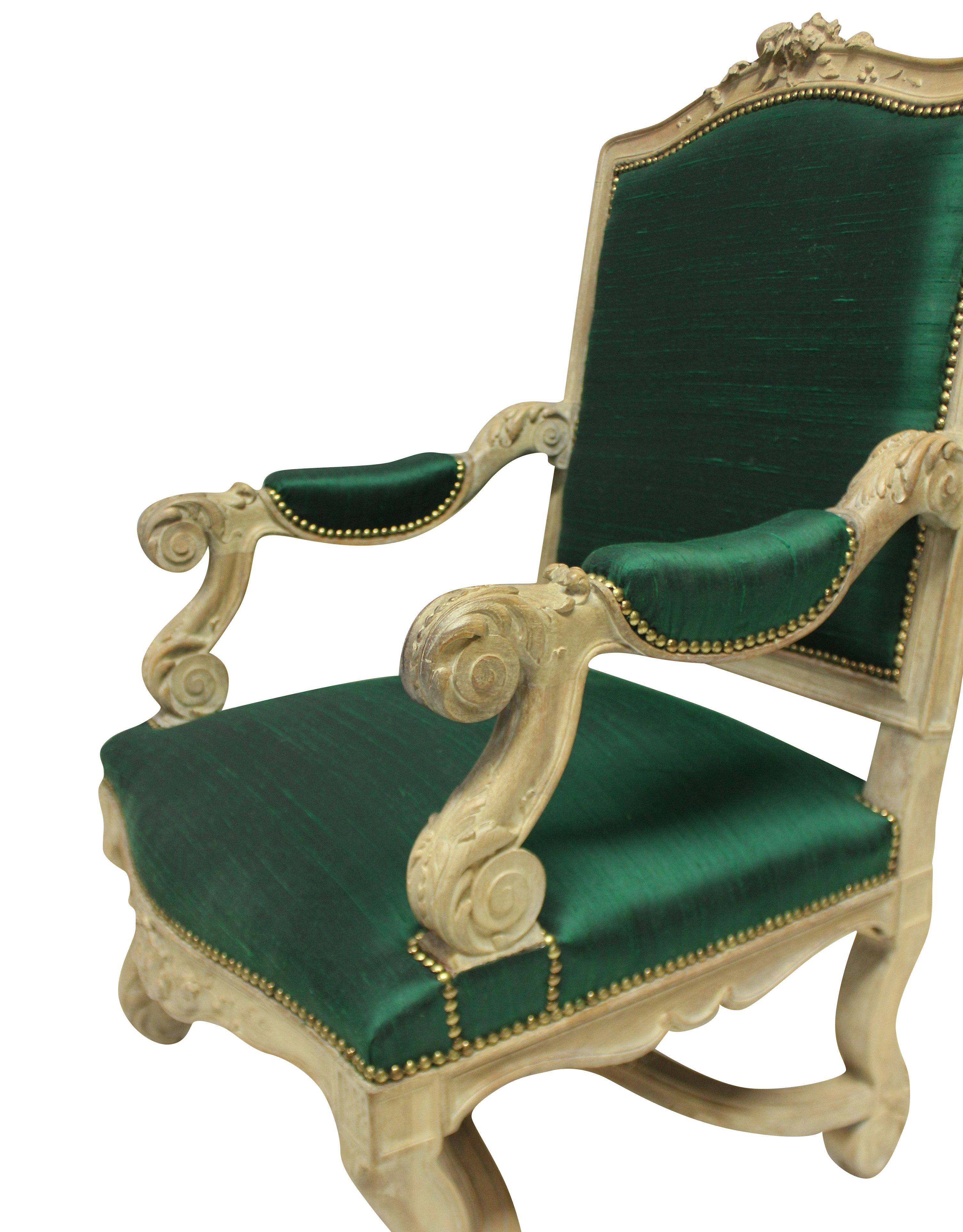 A French Louis XIV style armchair in nicely carved pickled oak. Newly upholstered in textured emerald silk.