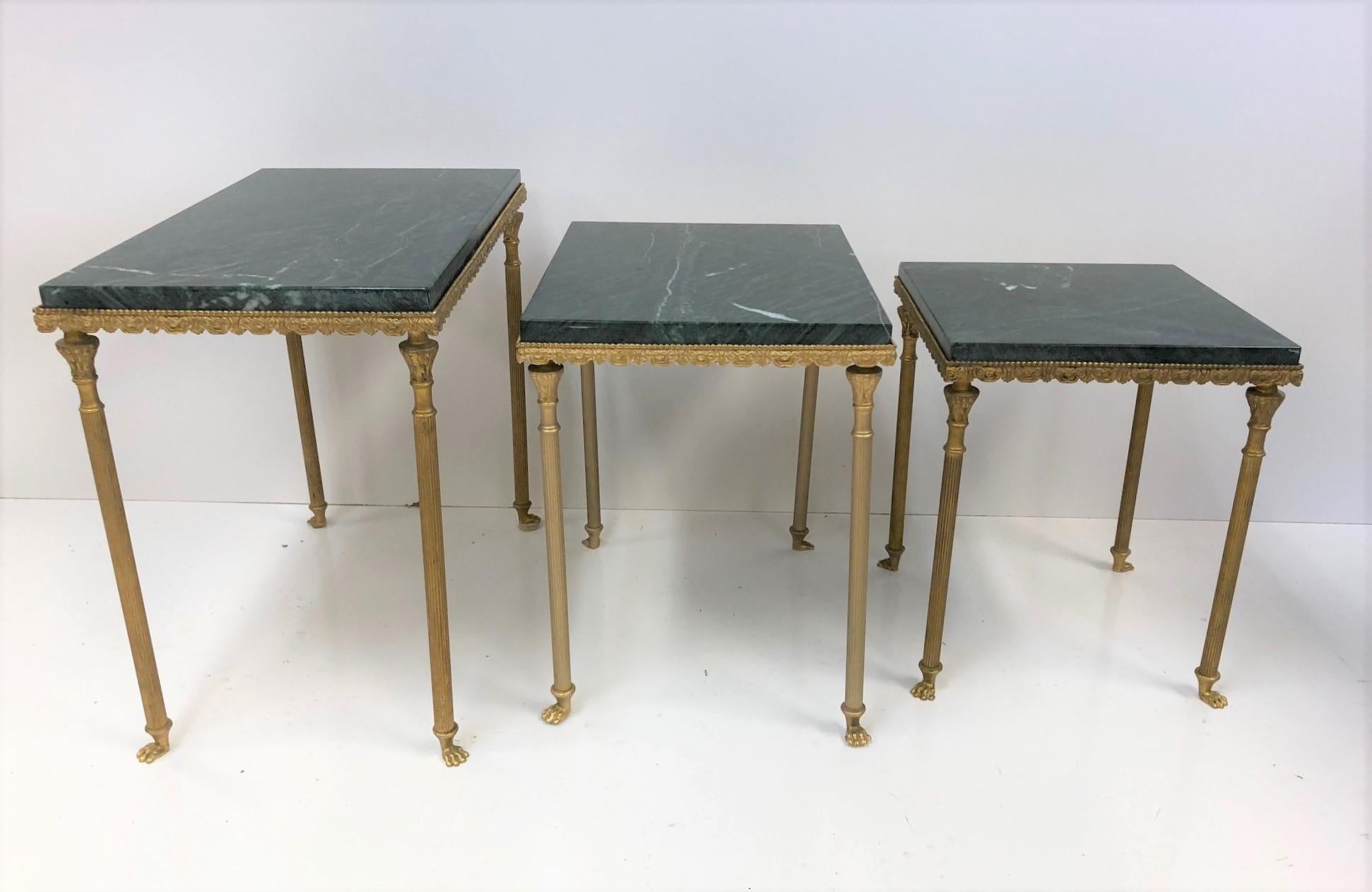 Louis XIV style bronze & marble nesting tables. Decorative bronze frame has columned style legs with feet. Green marble tops.
Larger table measures: 17 H x 12 D x 19.75 W.