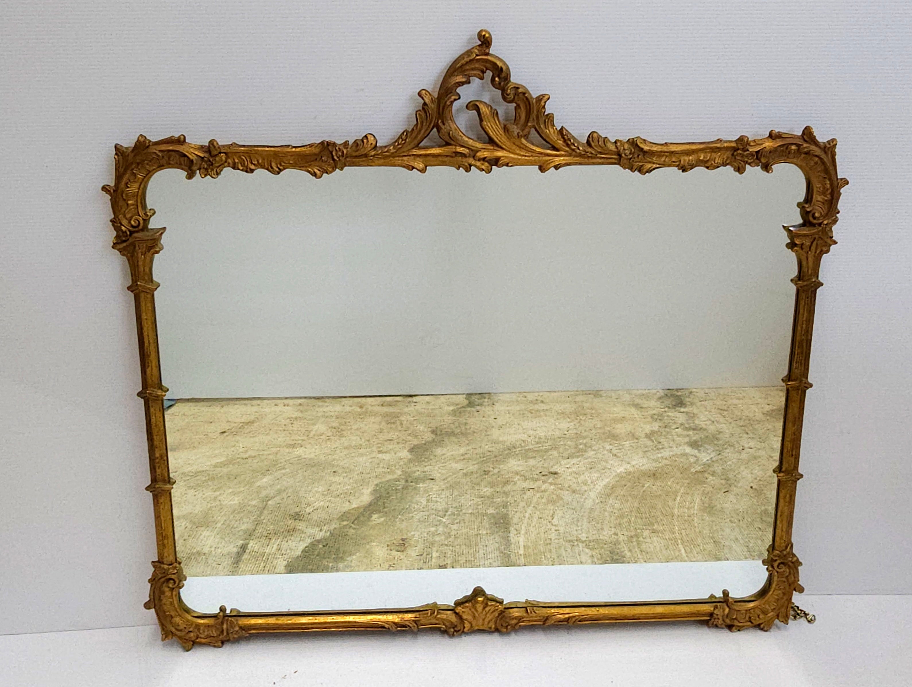 Louis XIV Style solid Carved Giltwood Foliate Crest Frame Wall Mirror, Circa 1920s
Measures 46