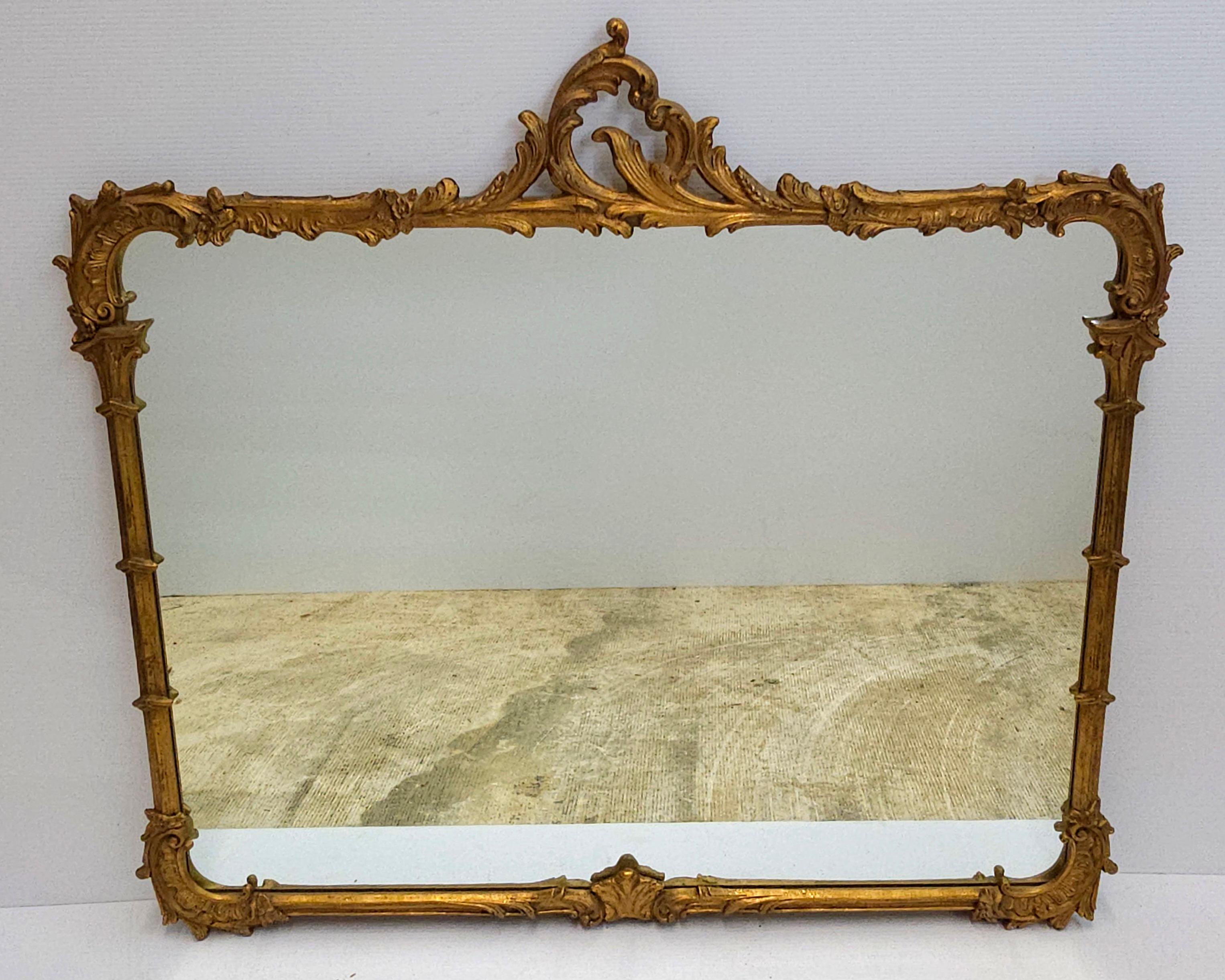 American Louis XIV Style Carved Gilt Foliate Frame Wall Mirror, Circa 1920s For Sale