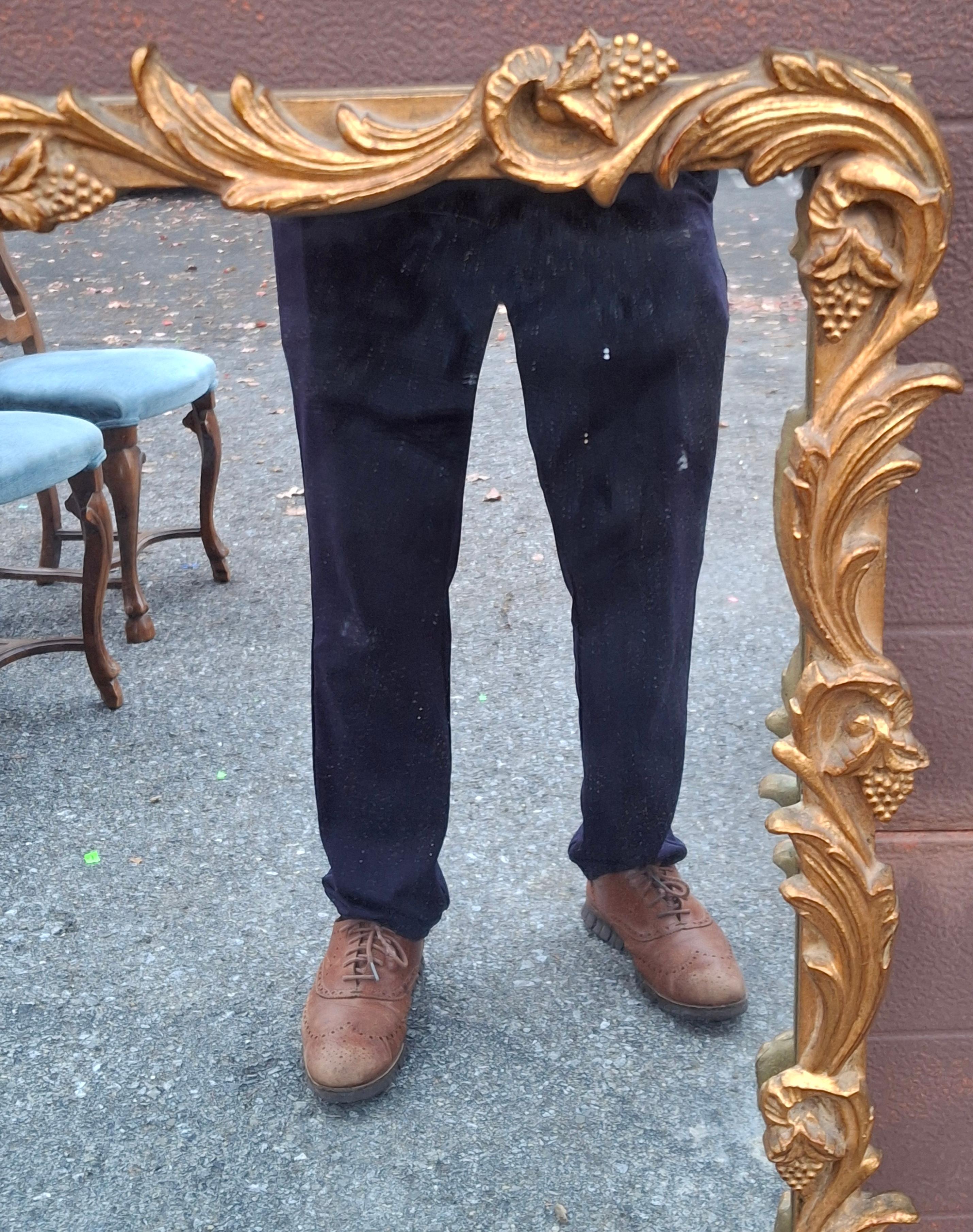 20ième siècle Louis XIV Style Carved Giltwood Foliate Frame Wall Mirror, Circa 1920s en vente