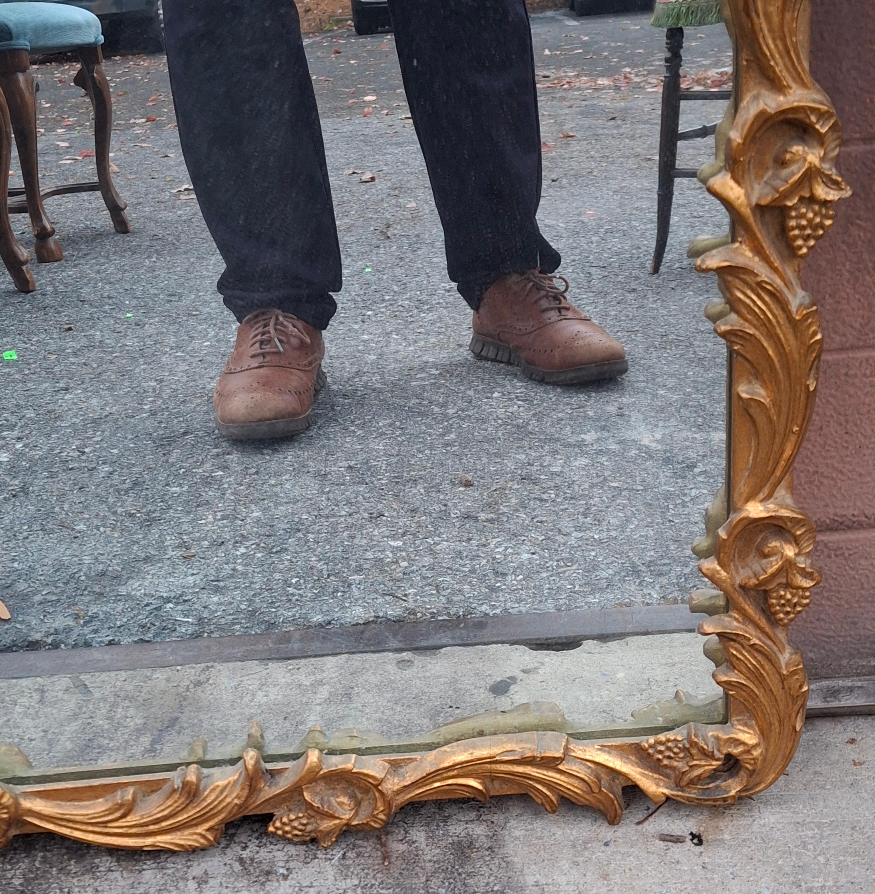 Bois Louis XIV Style Carved Giltwood Foliate Frame Wall Mirror, Circa 1920s en vente