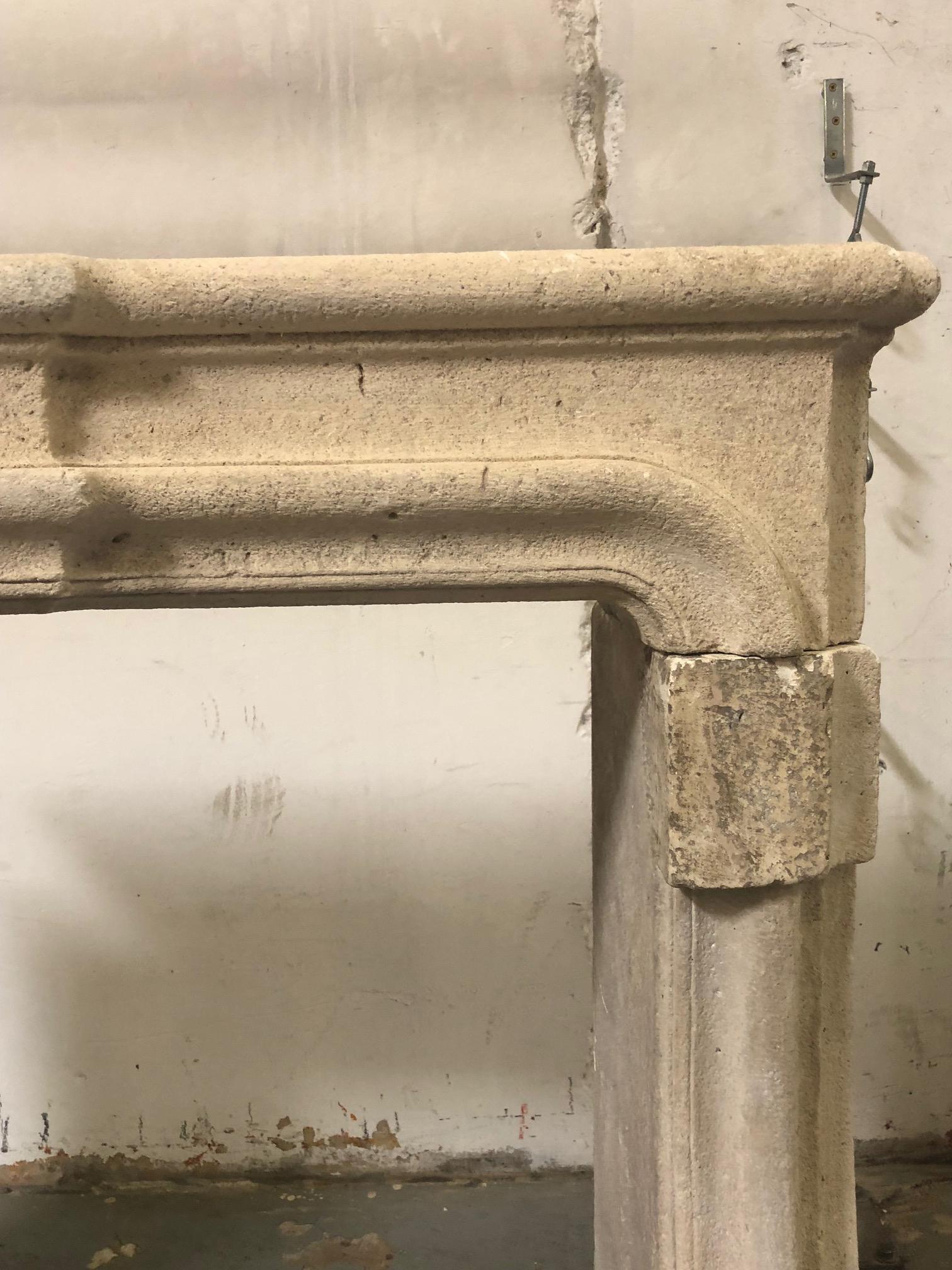 Hand-Carved Louis XIV Style Carved Limestone Fireplace Mantel For Sale