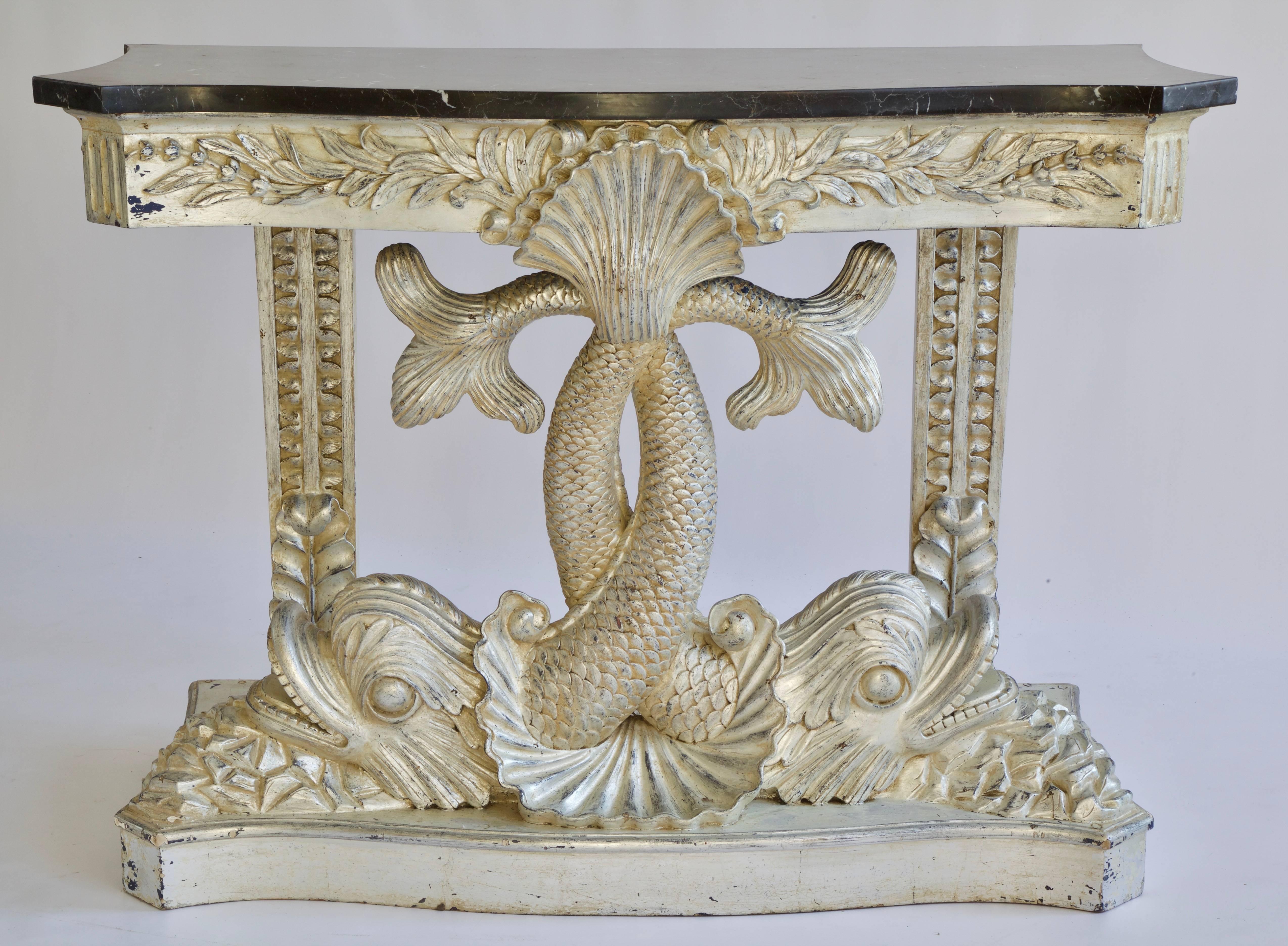 Louis XIV style console au Dauphins, silver finish with a St Laurent black marble (with white veins).