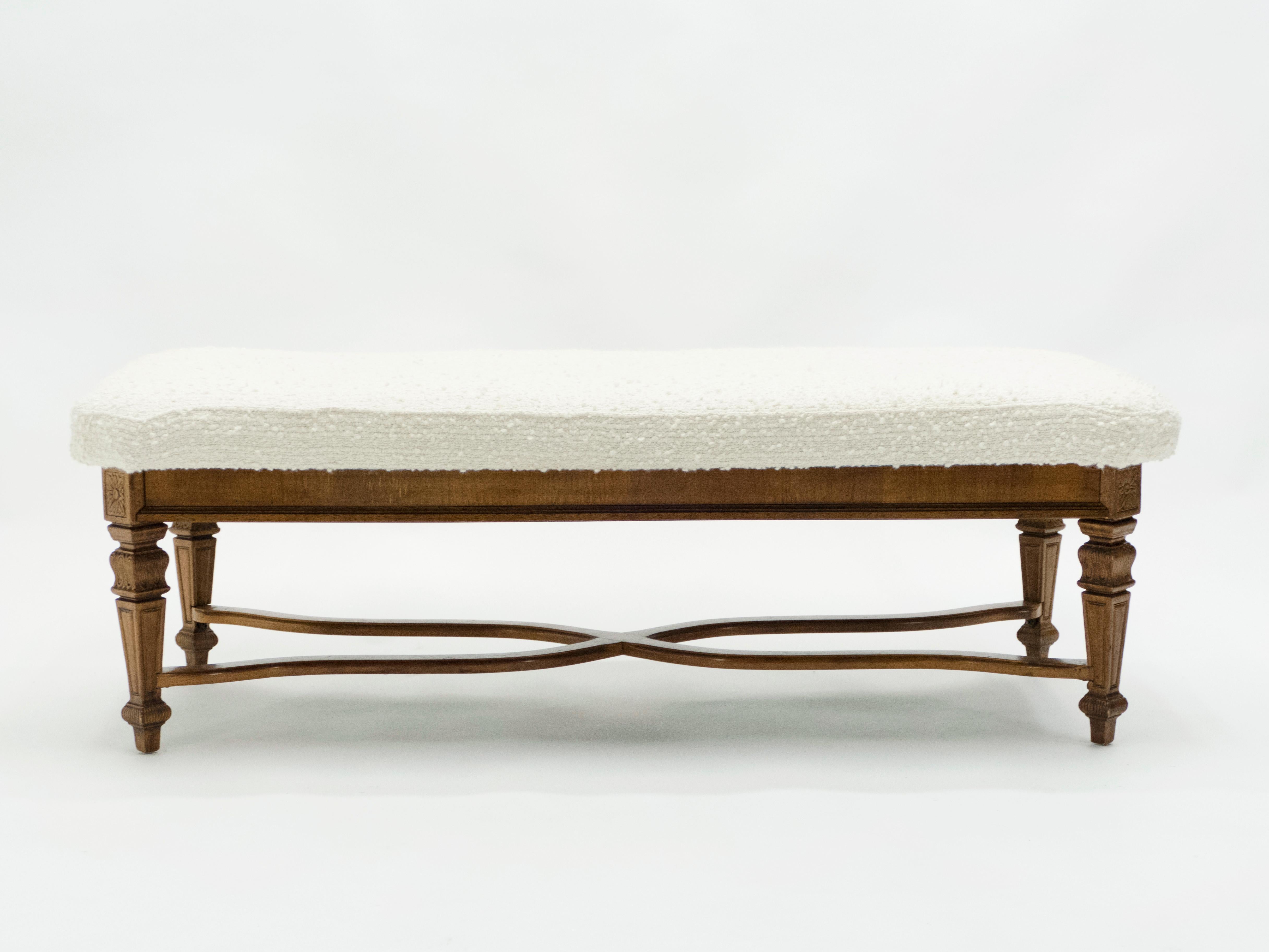 This beautiful Louis XIV style French bench was made in solid patinated oak in the early 1920s. Fully restored and newly upholstered with a large wool bouclette from Nobilis, this large bench will be a perfect addition to the foot of your bed, to