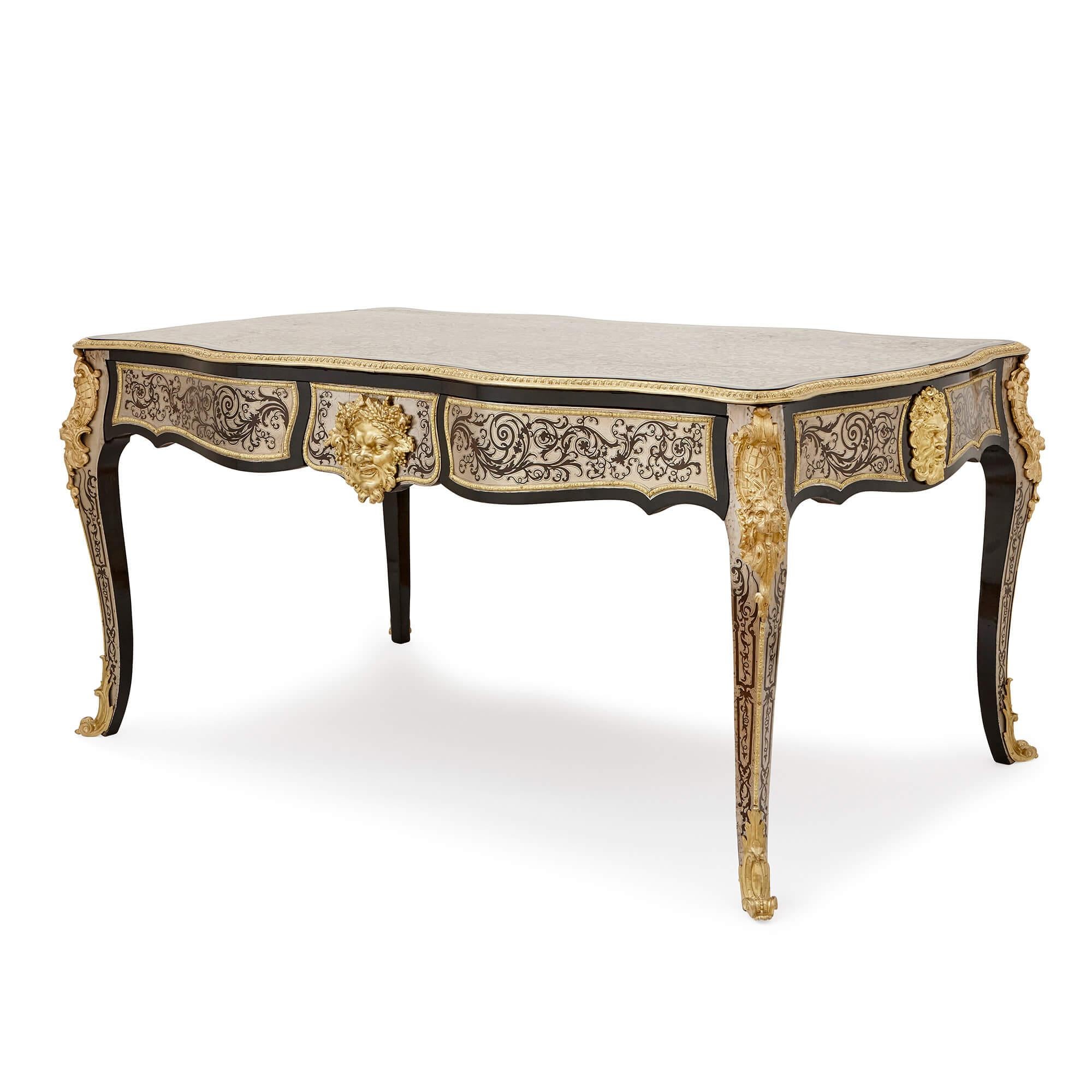 This splendid writing desk is an example of skilled craftsmanship of the highest order, and features some breathtakingly complex Boulle work all around its surface. The tabletop is particularly remarkable, showing a veneer of intricately-cut pieces